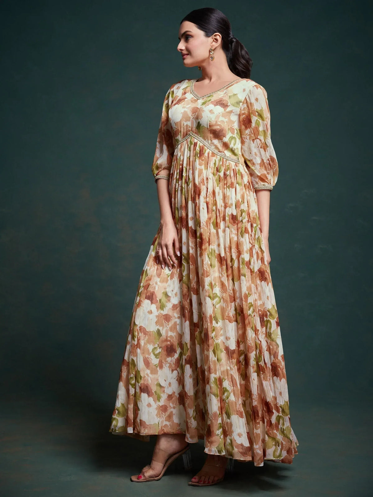Floral print ethnic gown with pleated skirt and gold trim, perfect for Indian occasions
