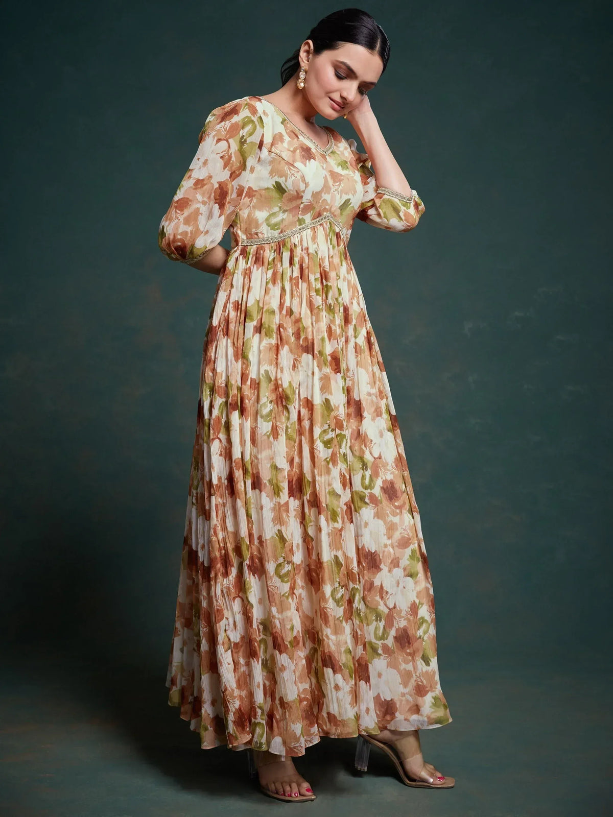 Floral print ethnic gown with pleated skirt and gold trim, perfect for Indian occasions