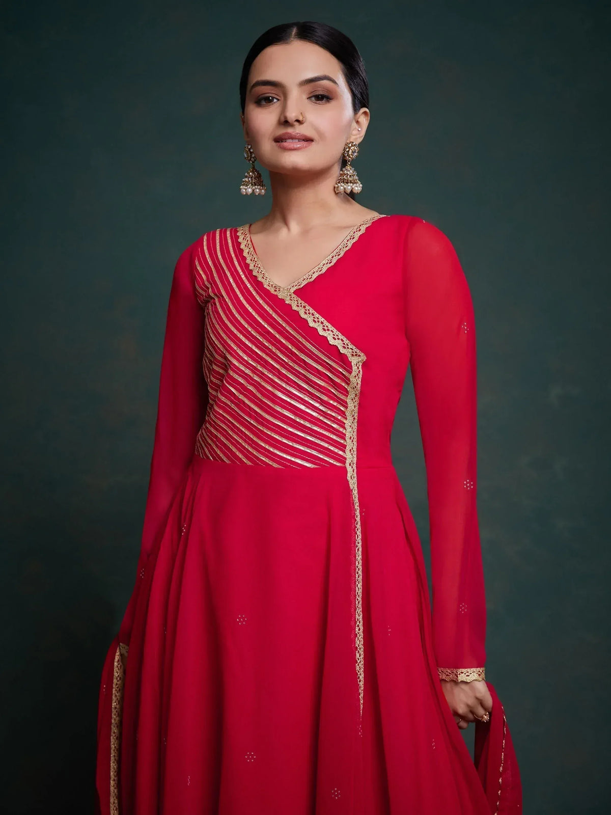 Red ethnic gown with gold embroidery, perfect for Indian occasions and weddings