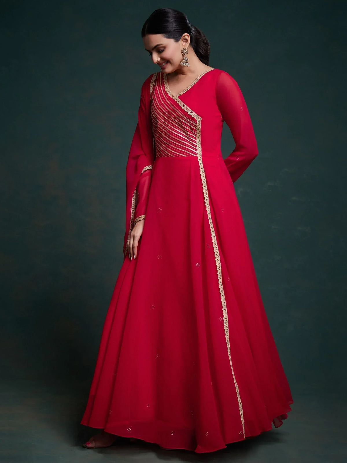 Red ethnic gown with gold embroidery, perfect for Indian weddings and festive occasions