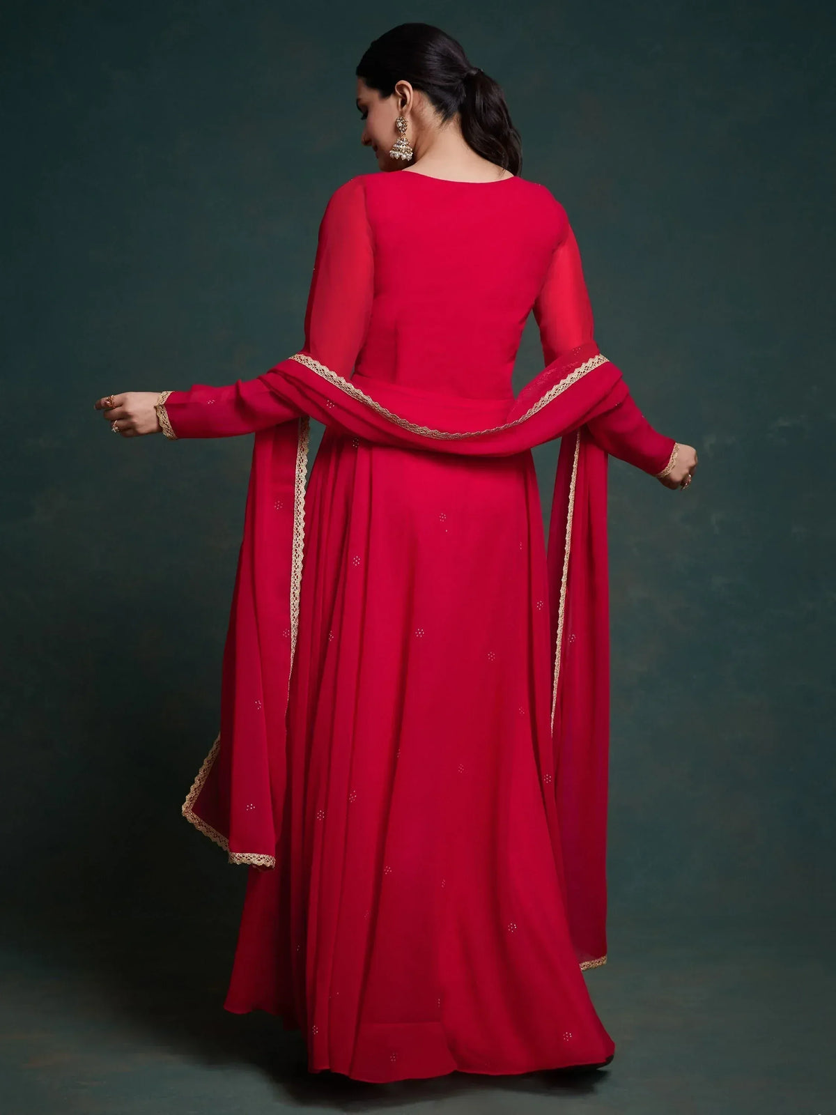 Red ethnic anarkali suit with gold lace detailing, perfect for Indian occasions and festive wear.
