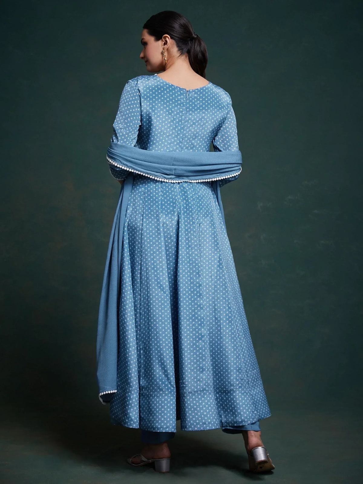 Blue printed ethnic anarkali suit with matching dupatta and pom-pom trim, perfect for Indian occasions.