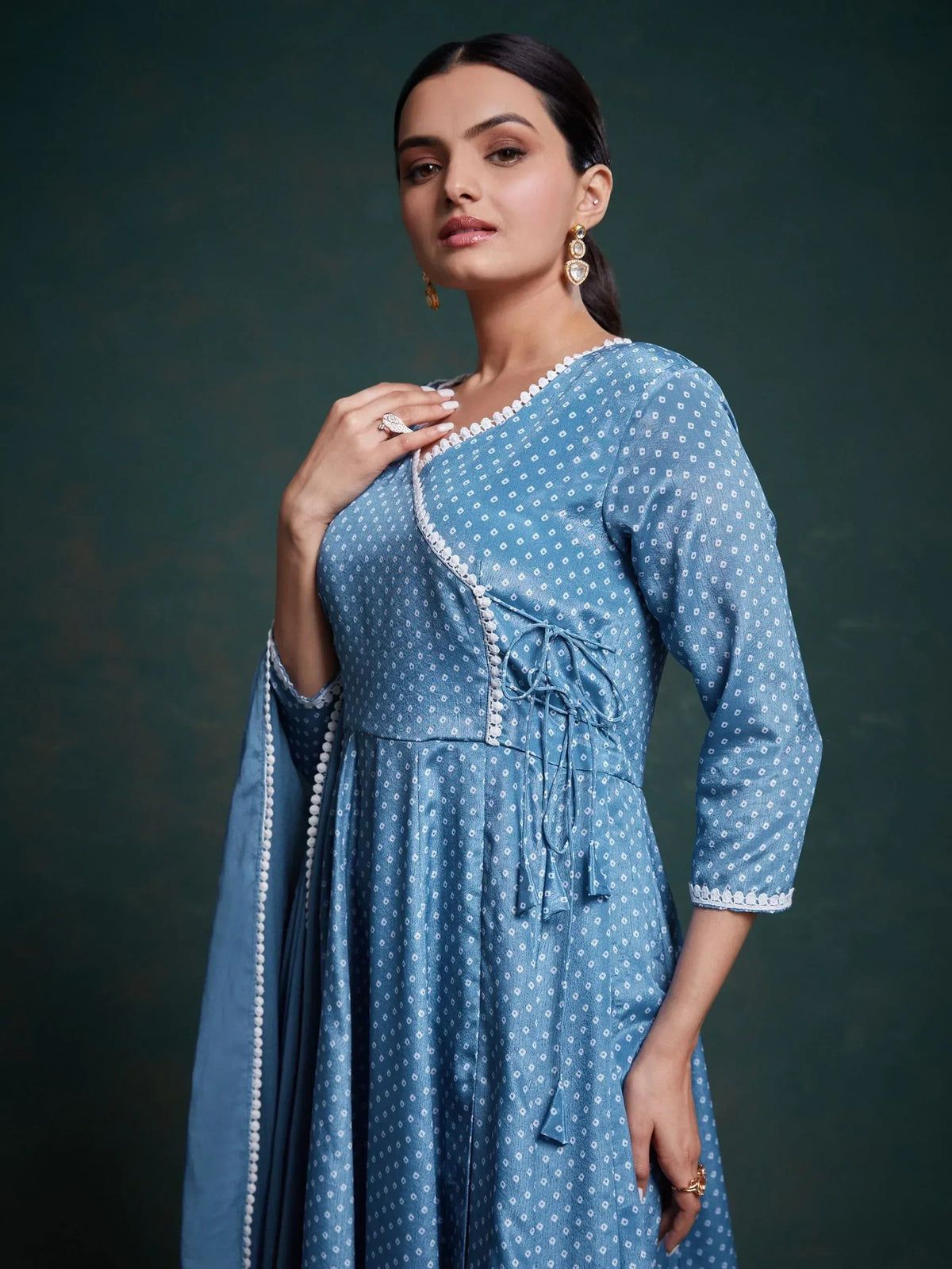 Blue printed ethnic gown with white embroidery and tie-up detail, perfect for Indian occasions
