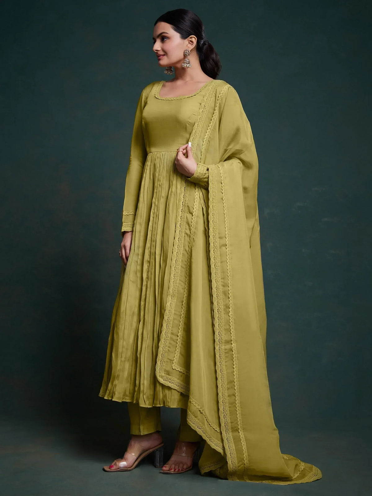 Olive green ethnic anarkali suit with lace detailing and pleated skirt, perfect for Indian occasions.