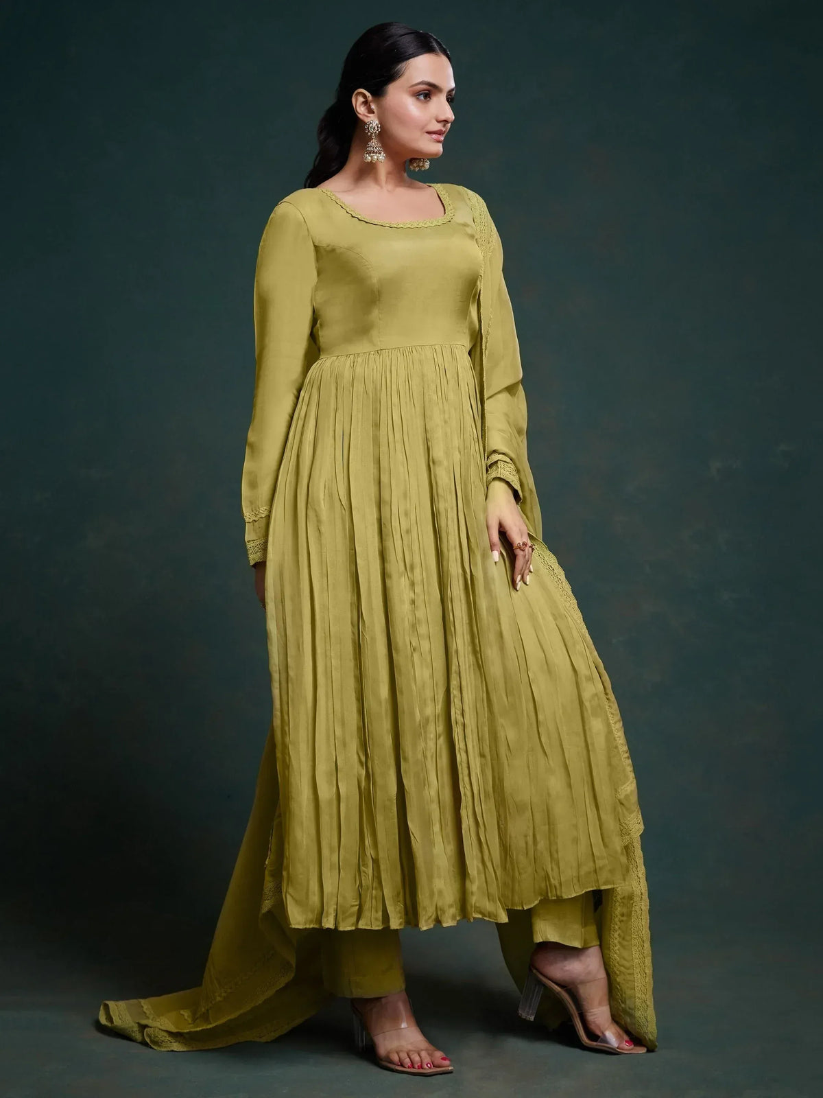 Olive green pleated anarkali suit with lace detailing, perfect for ethnic occasions and festive wear.