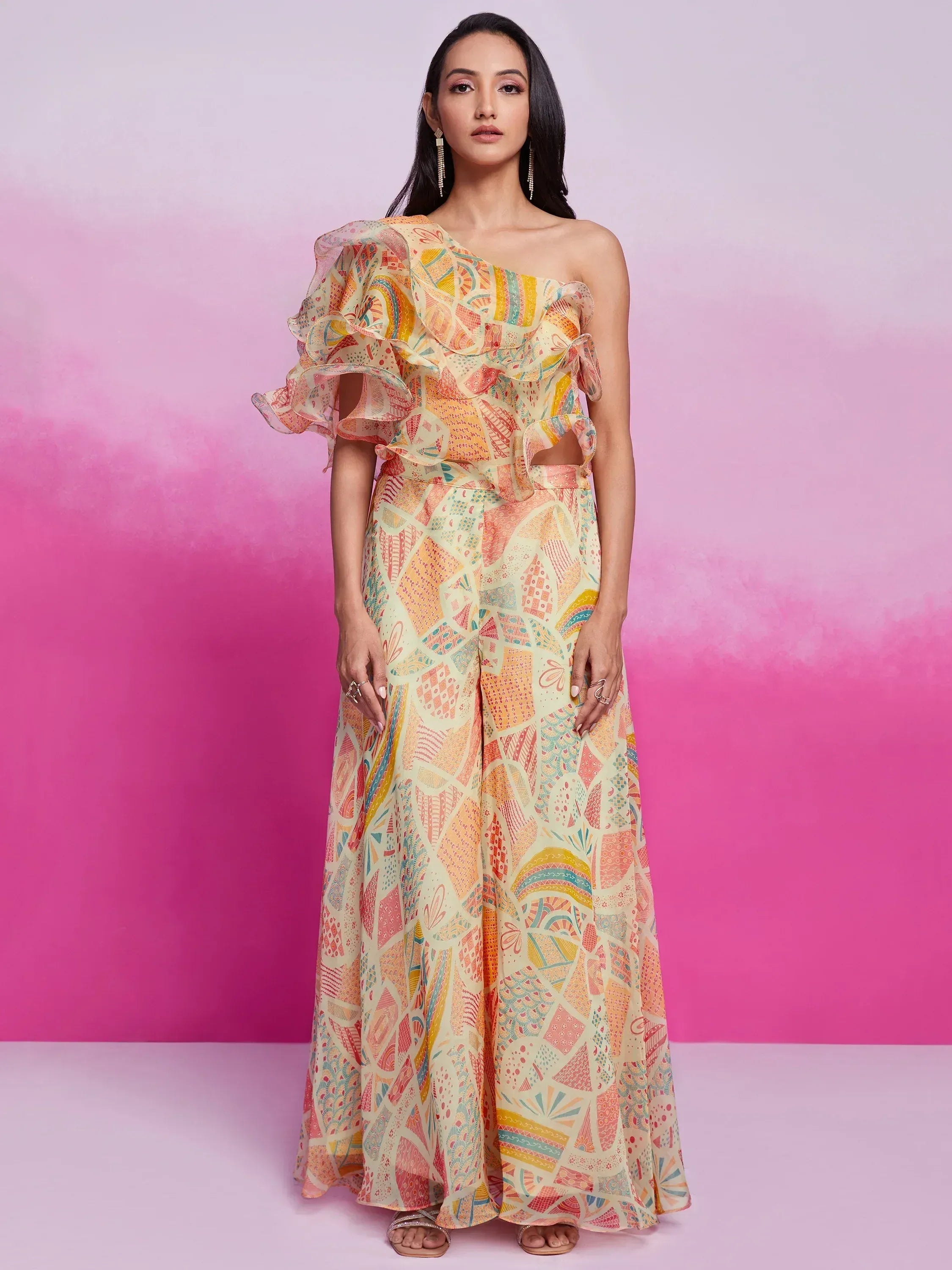 Woman wearing pastel multicolor one-shoulder ruffled ethnic gown with abstract print