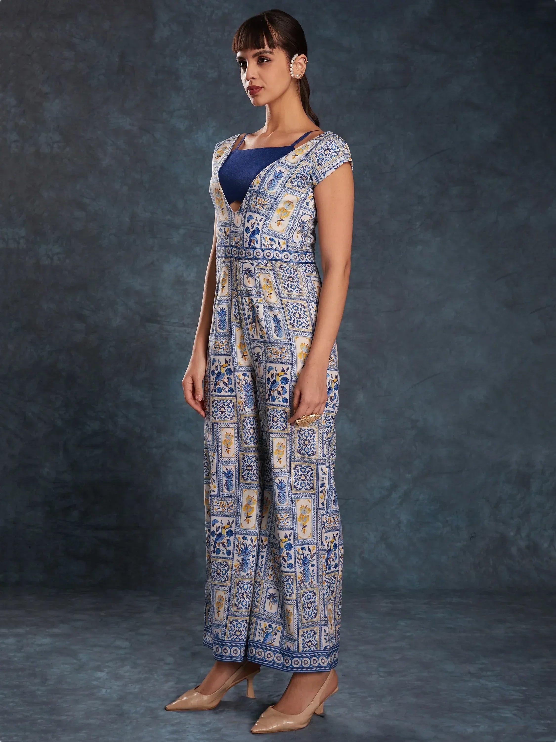 Blue and white printed ethnic gown with floral and pineapple motifs, perfect for Indian occasions