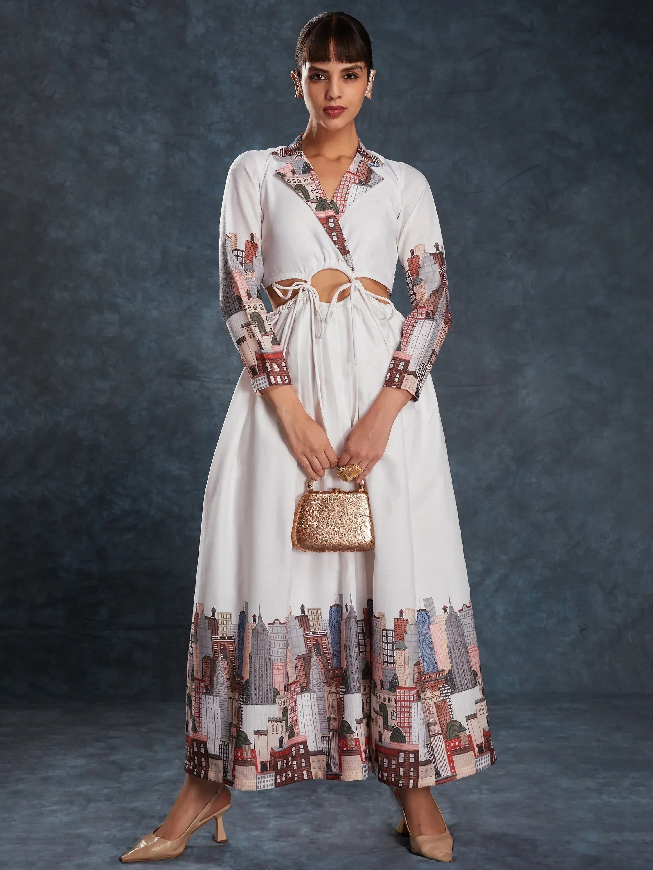 White ethnic gown with city print, side cutouts, and matching skirt for modern Indian wear