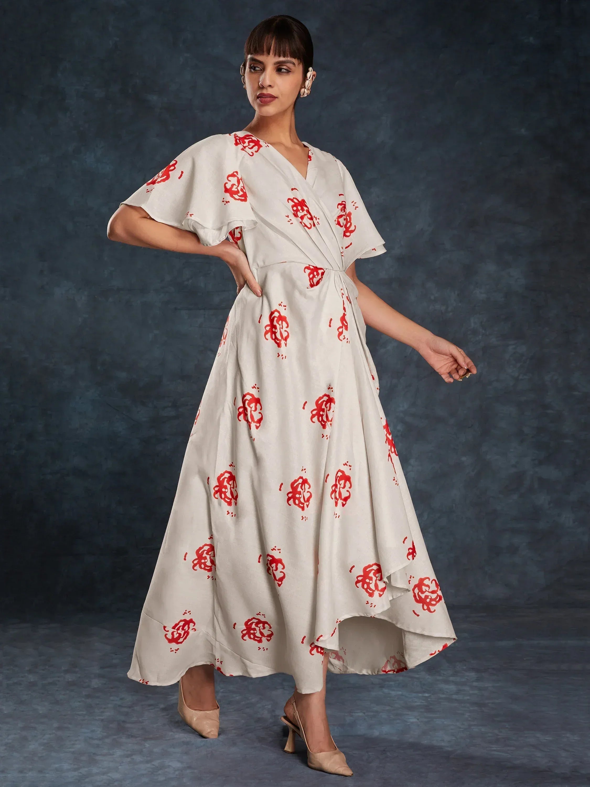 White ethnic gown with red floral print, V-neck, and flared sleeves for women