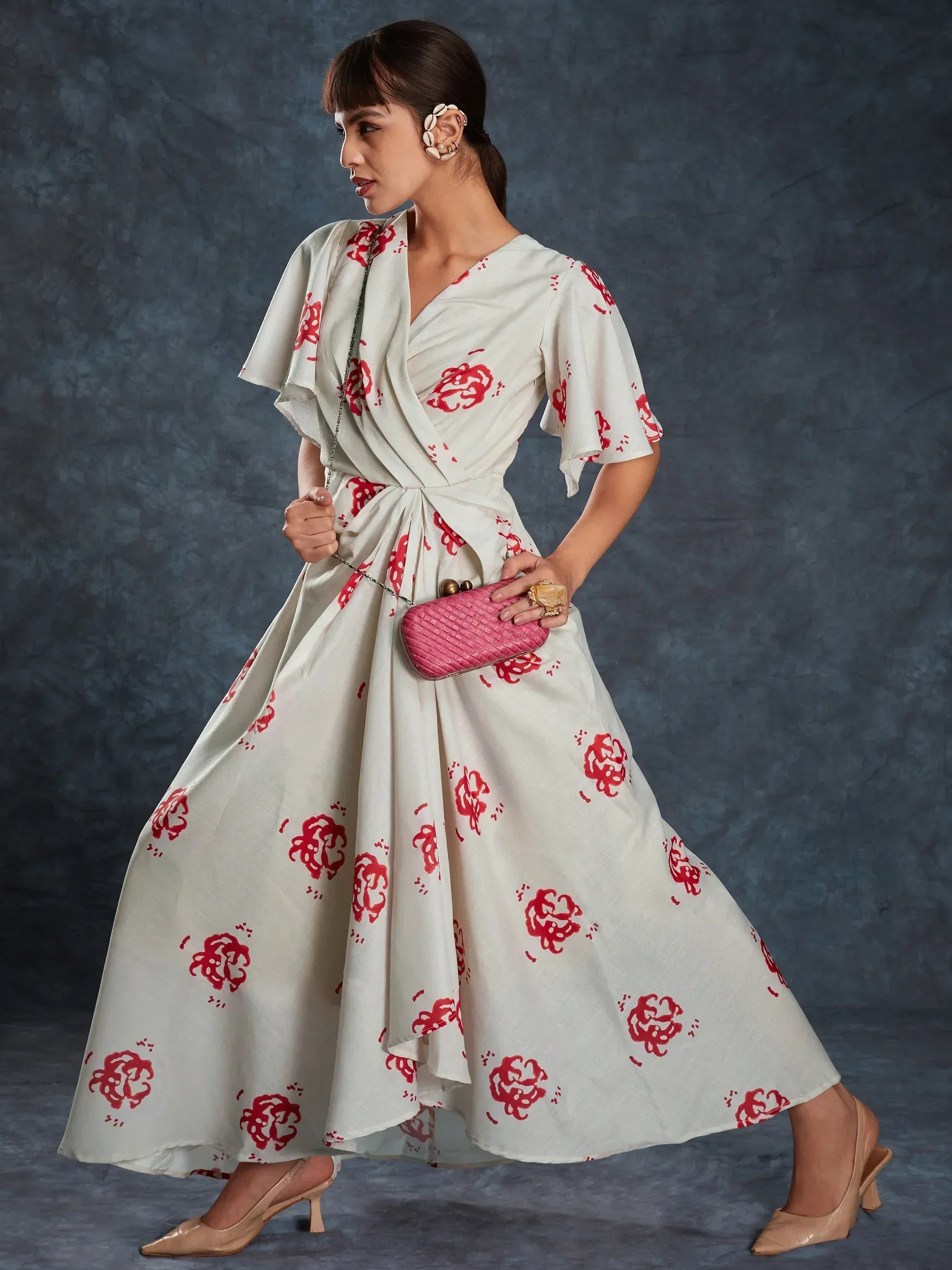 White ethnic gown with red floral print, perfect for Indian occasions and events