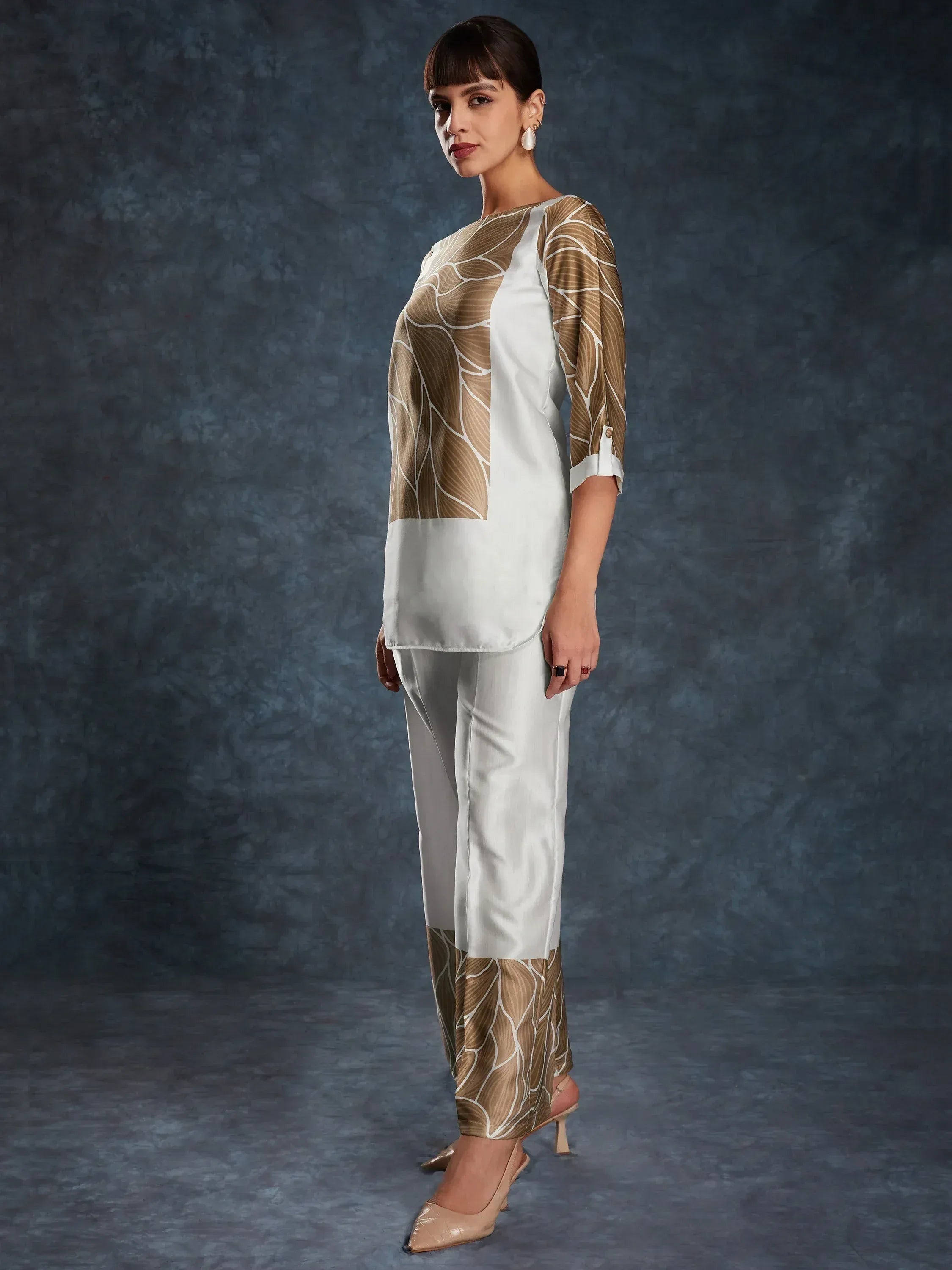 White and gold printed ethnic salwar kameez with modern cut, perfect for festive occasions