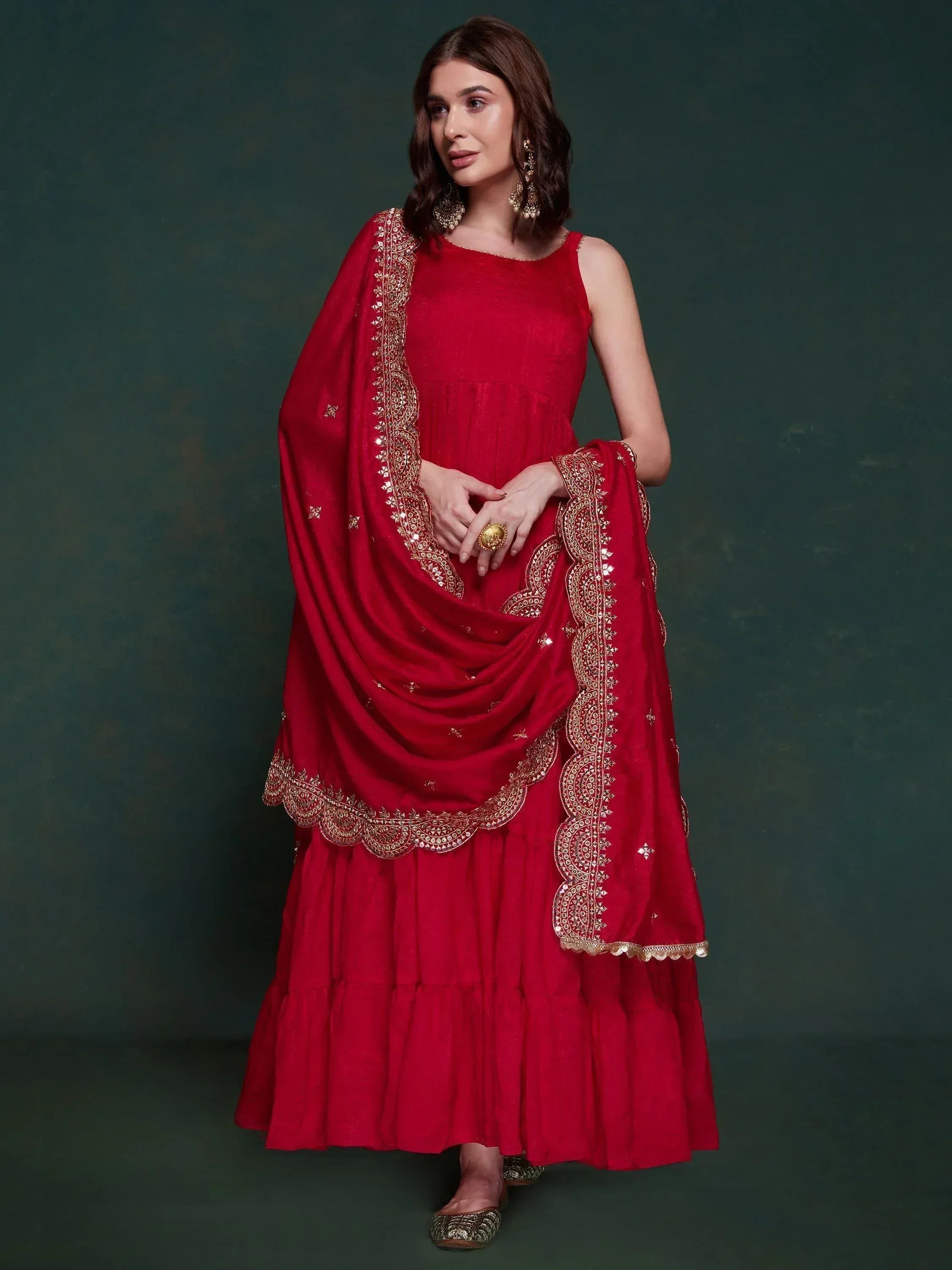 Red ethnic gown with gold embroidery and matching dupatta, perfect for Indian occasions