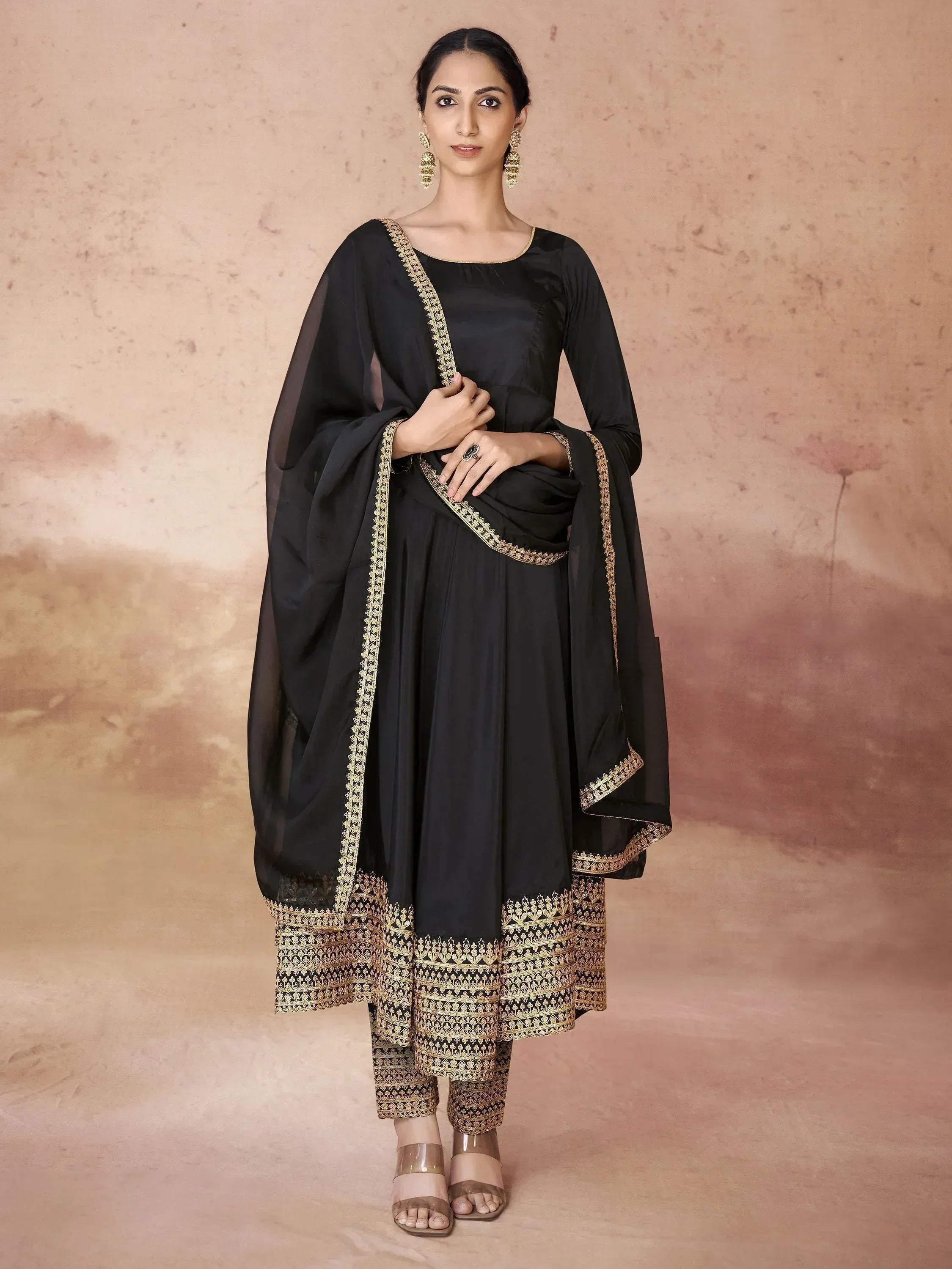 Black ethnic salwar kameez with gold embroidery, perfect for Indian occasions and festive wear.