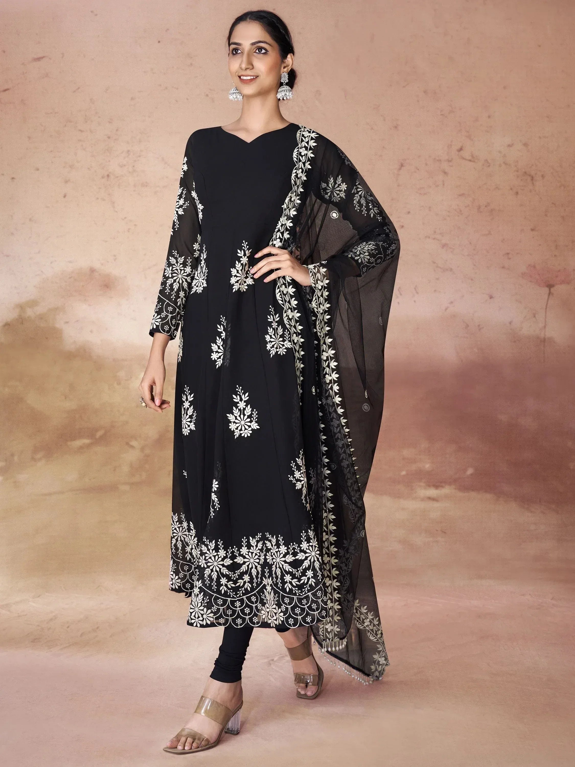 Black embroidered salwar kameez with white floral motifs and sheer dupatta, ethnic Indian wear