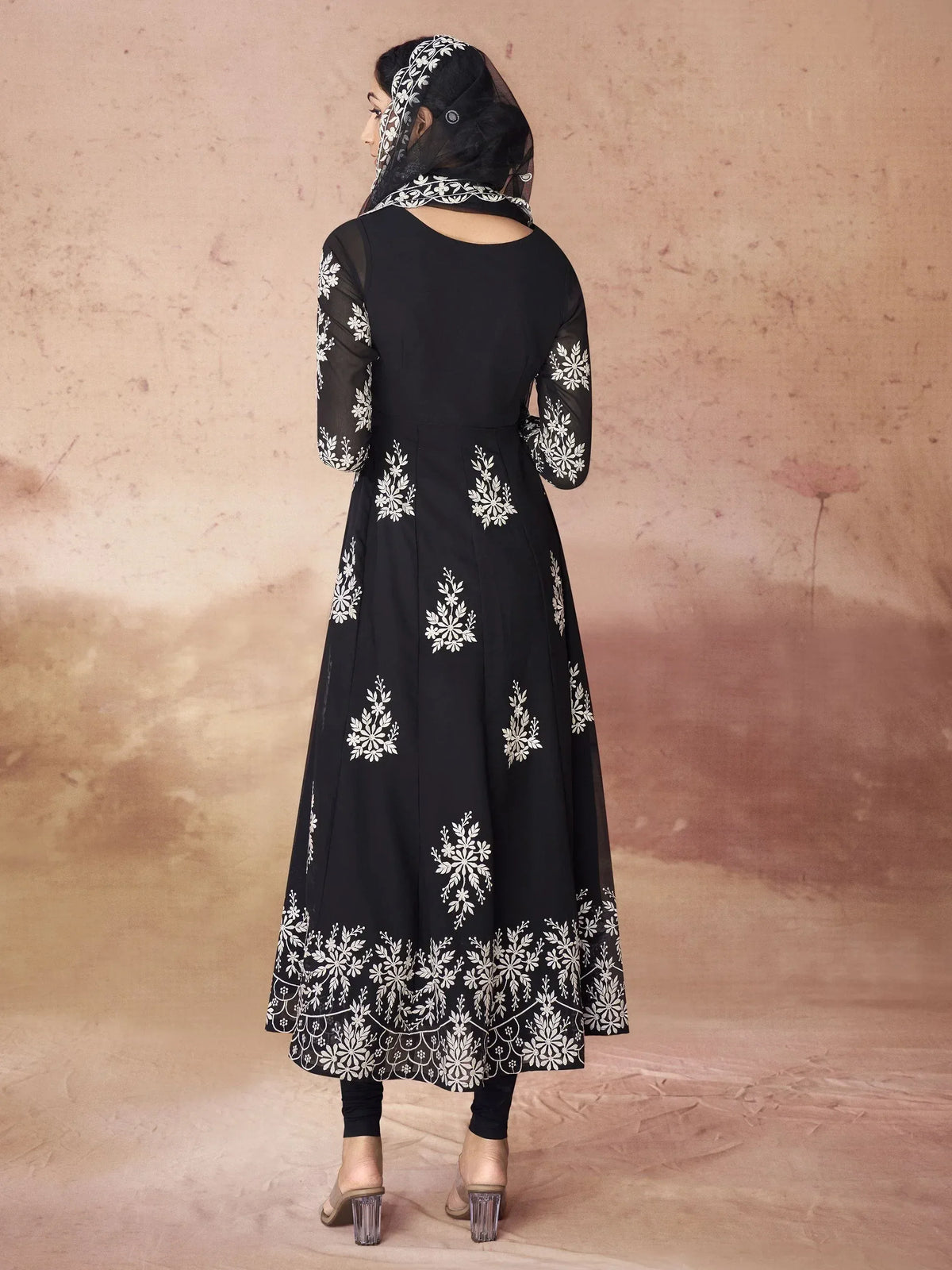 Black anarkali with white floral embroidery, sheer sleeves, and matching dupatta for ethnic wear