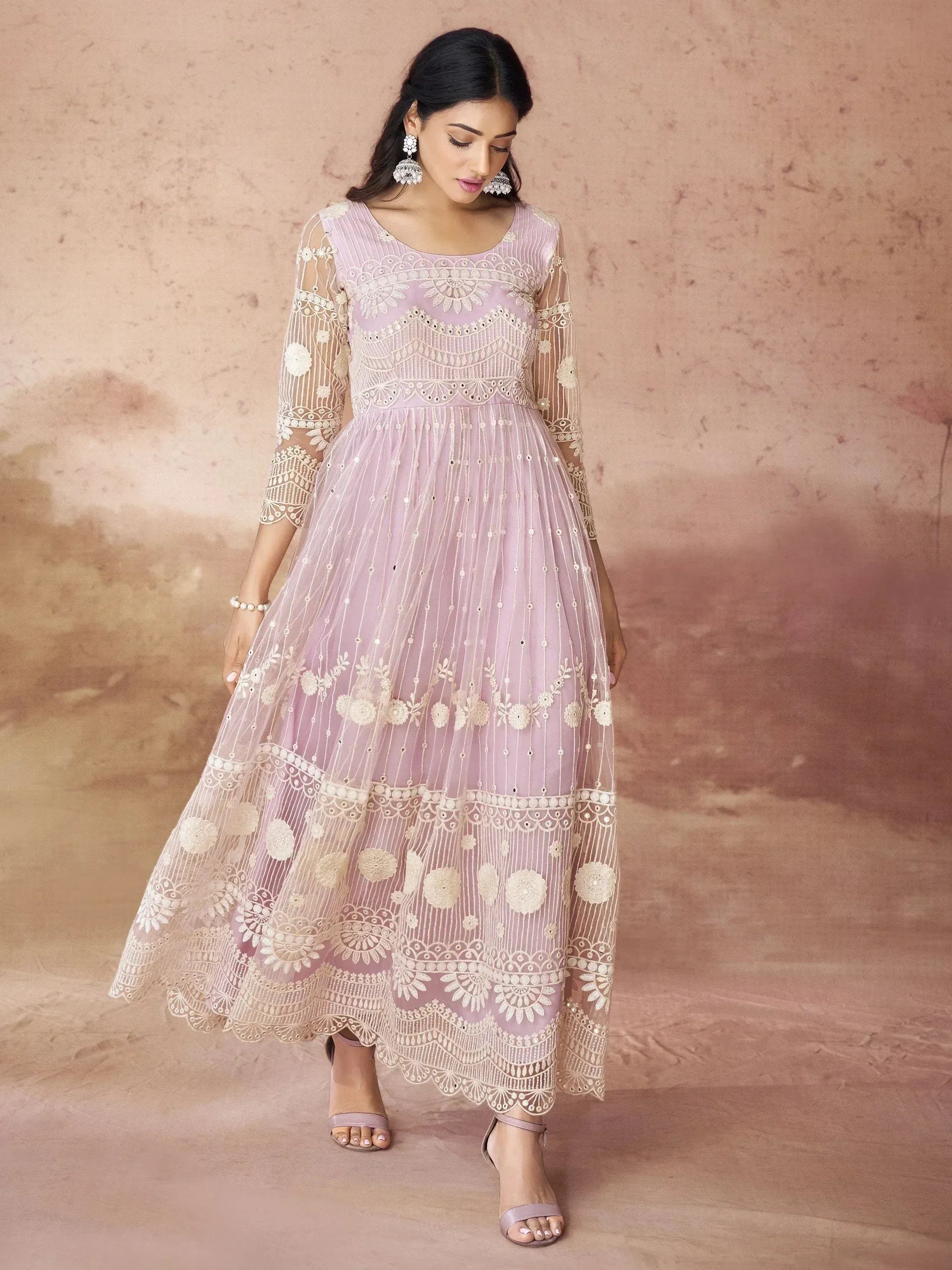 Elegant lavender ethnic gown with intricate white embroidery and sheer sleeves for festive occasions