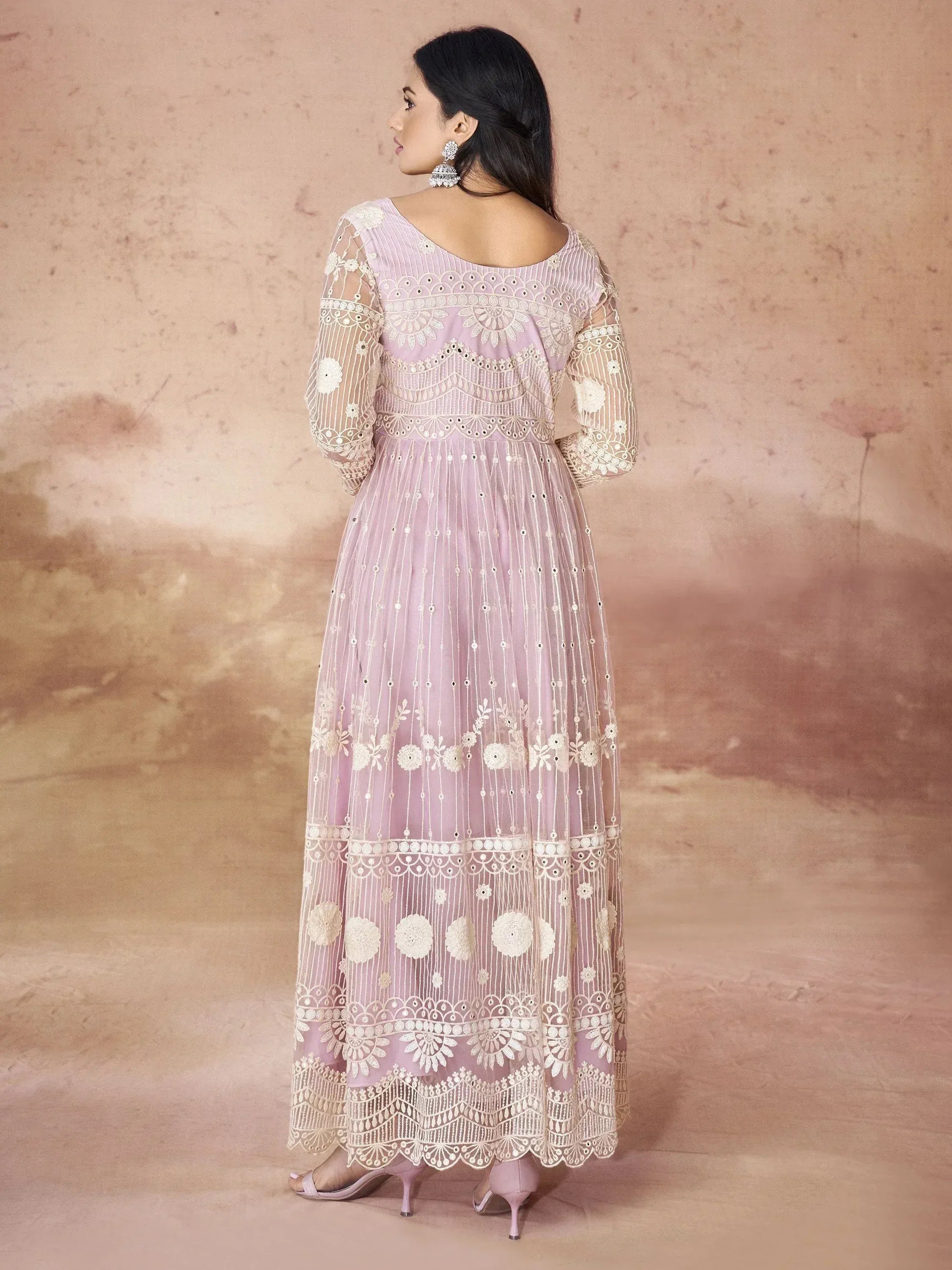 Lavender ethnic gown with white floral embroidery and sheer sleeves, perfect for Indian occasions