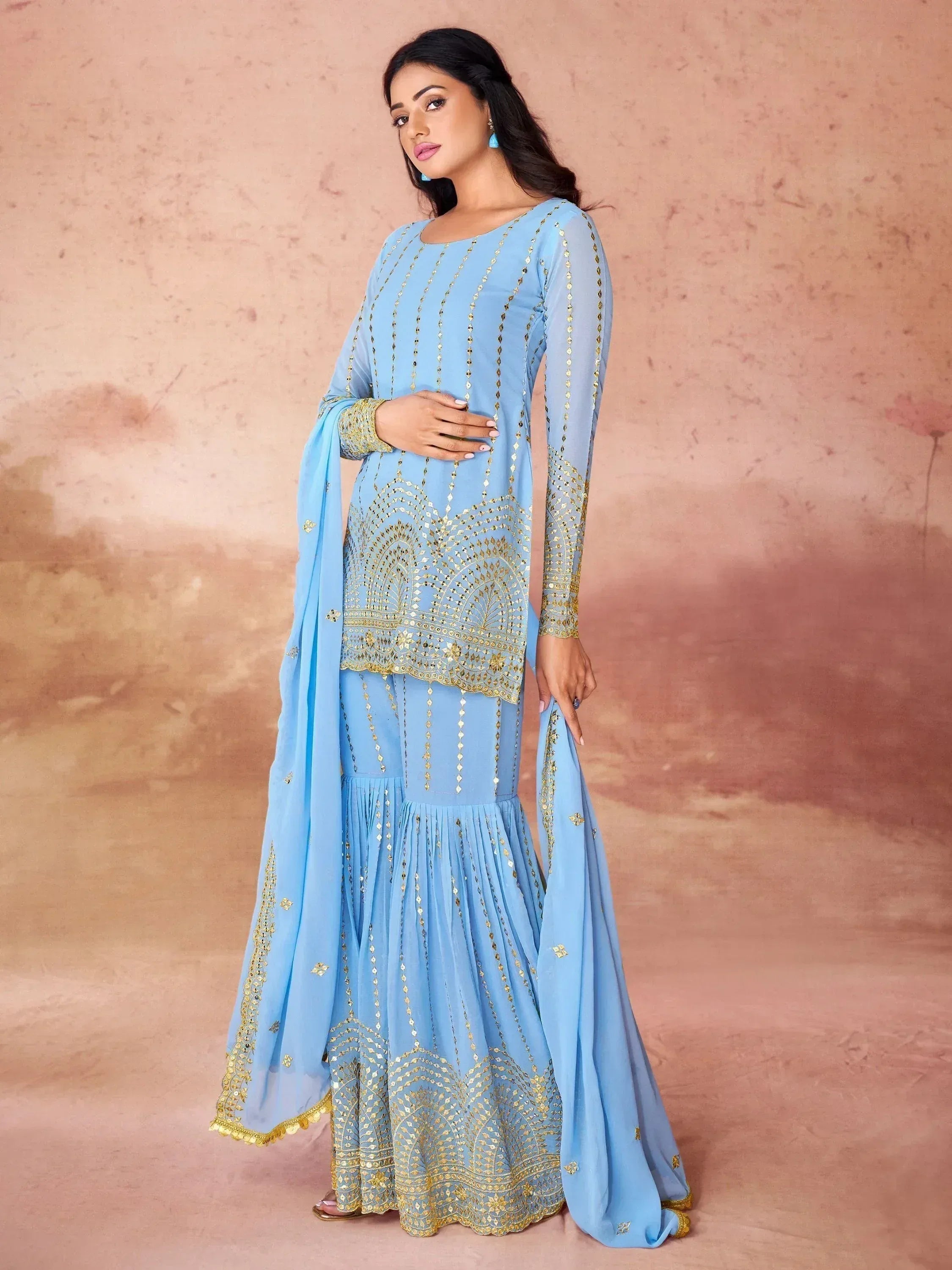 Light blue ethnic gown with gold embroidery, perfect for Indian festive occasions and weddings
