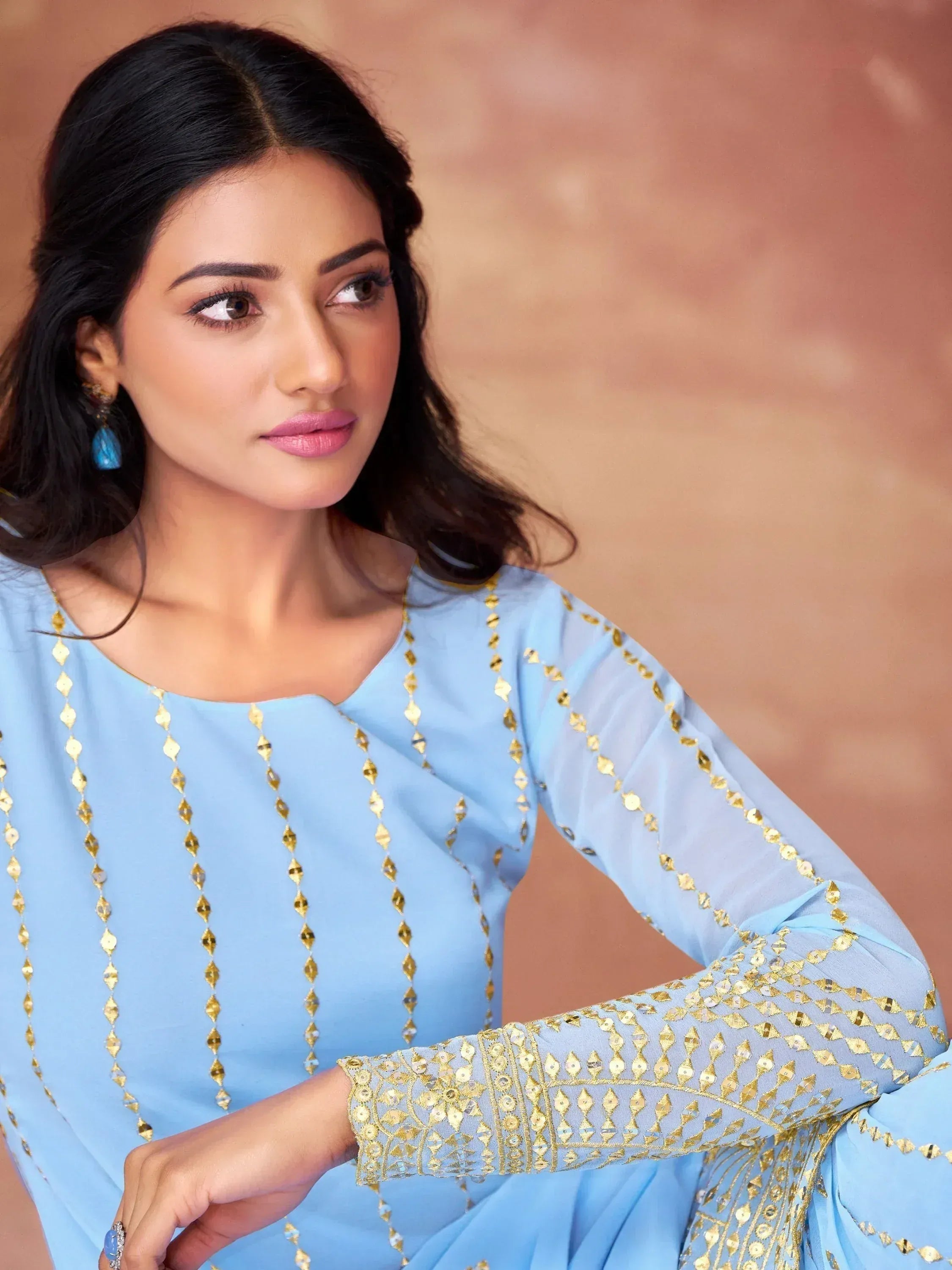 Light blue ethnic gown with gold sequin embroidery, perfect for Indian festive occasions