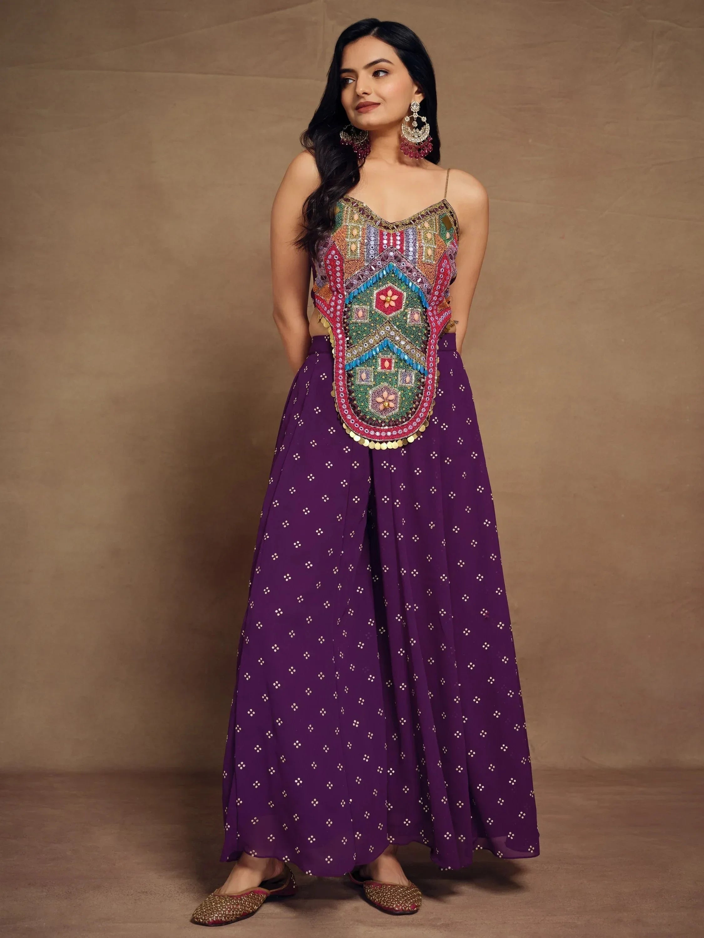 Woman in purple ethnic palazzo set with multicolor embroidered mirror work top