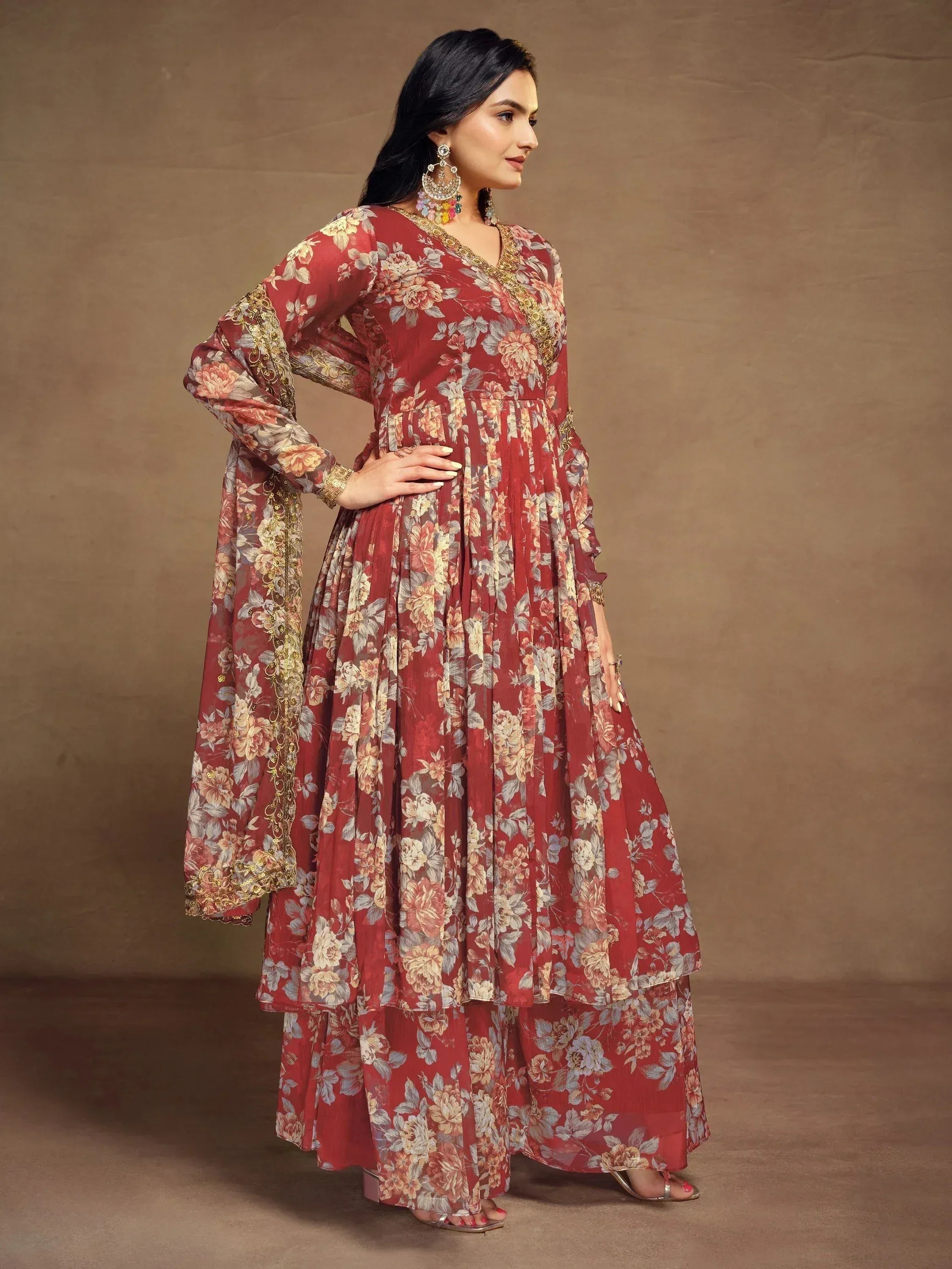 Red floral printed ethnic gown with gold embroidery, perfect for Indian occasions and festive wear.