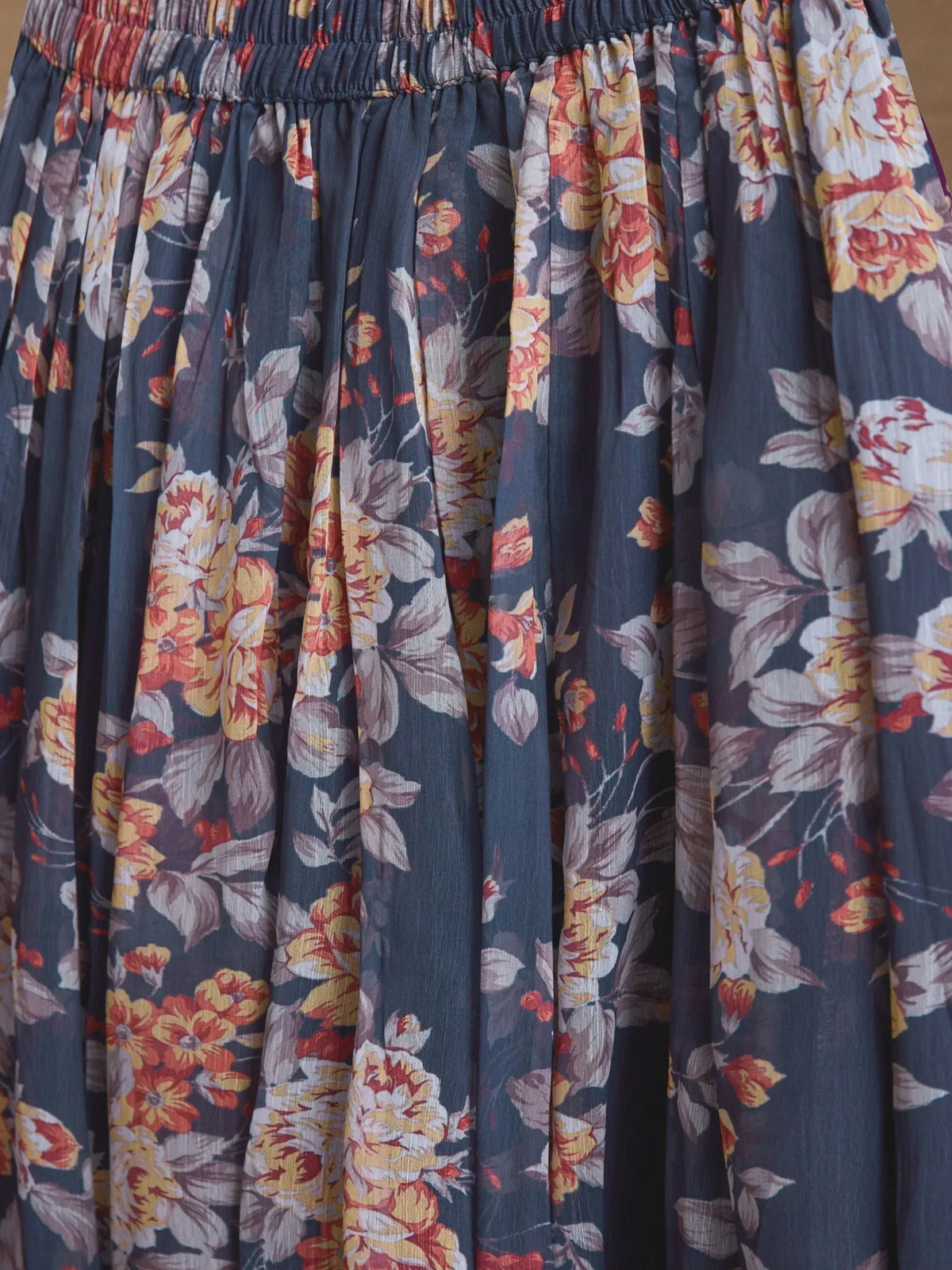 Floral print ethnic gown with pleated skirt and elastic waist, perfect for Indian occasions