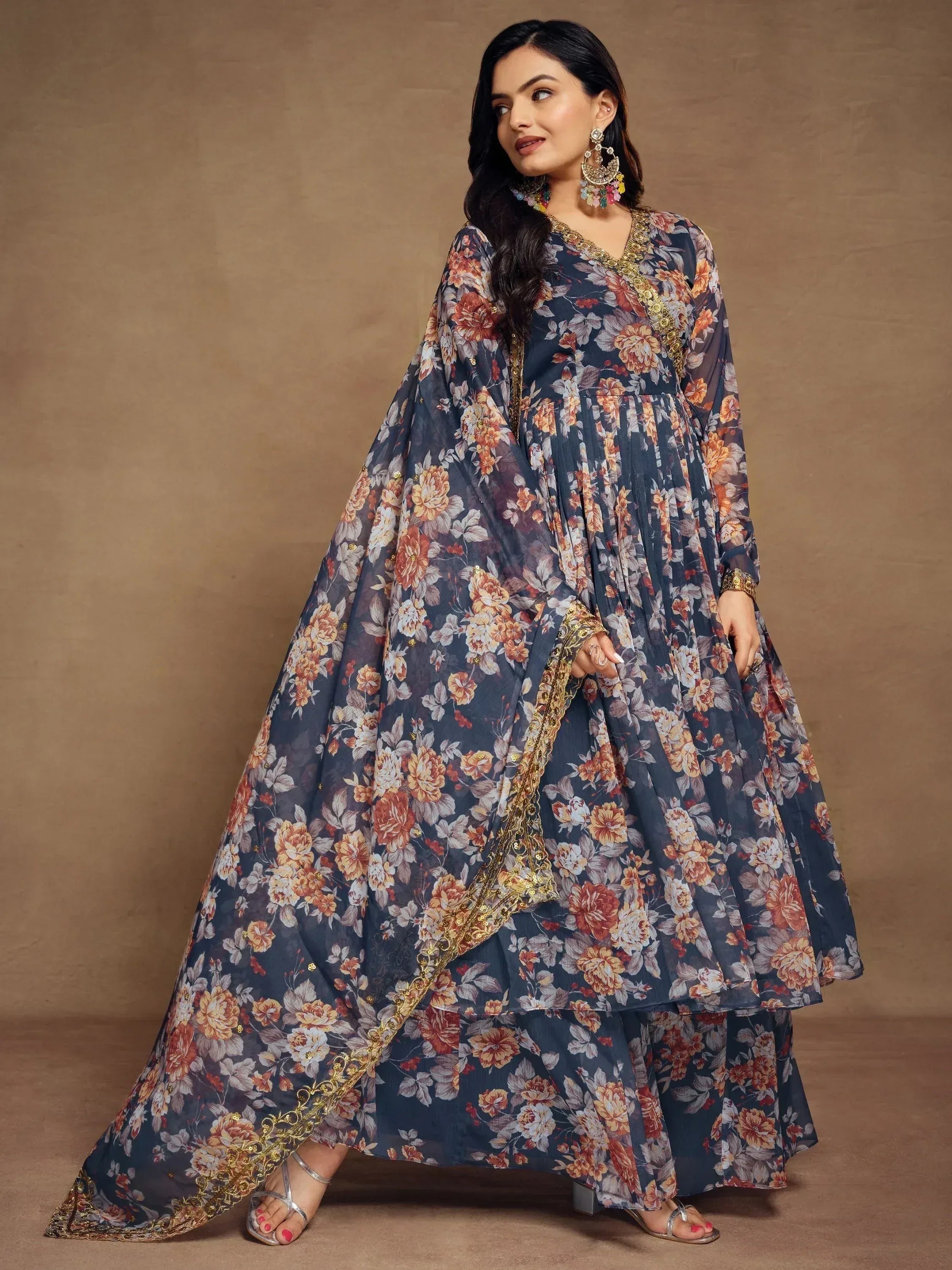 Floral print ethnic gown with gold embroidery, perfect for Indian festive occasions and parties.