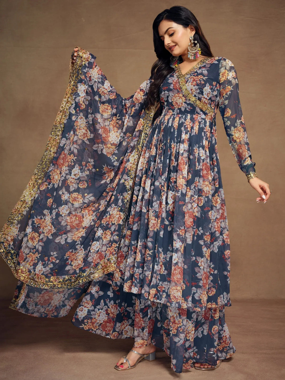 Floral print ethnic gown with gold embroidery, perfect for Indian occasions and festive wear.
