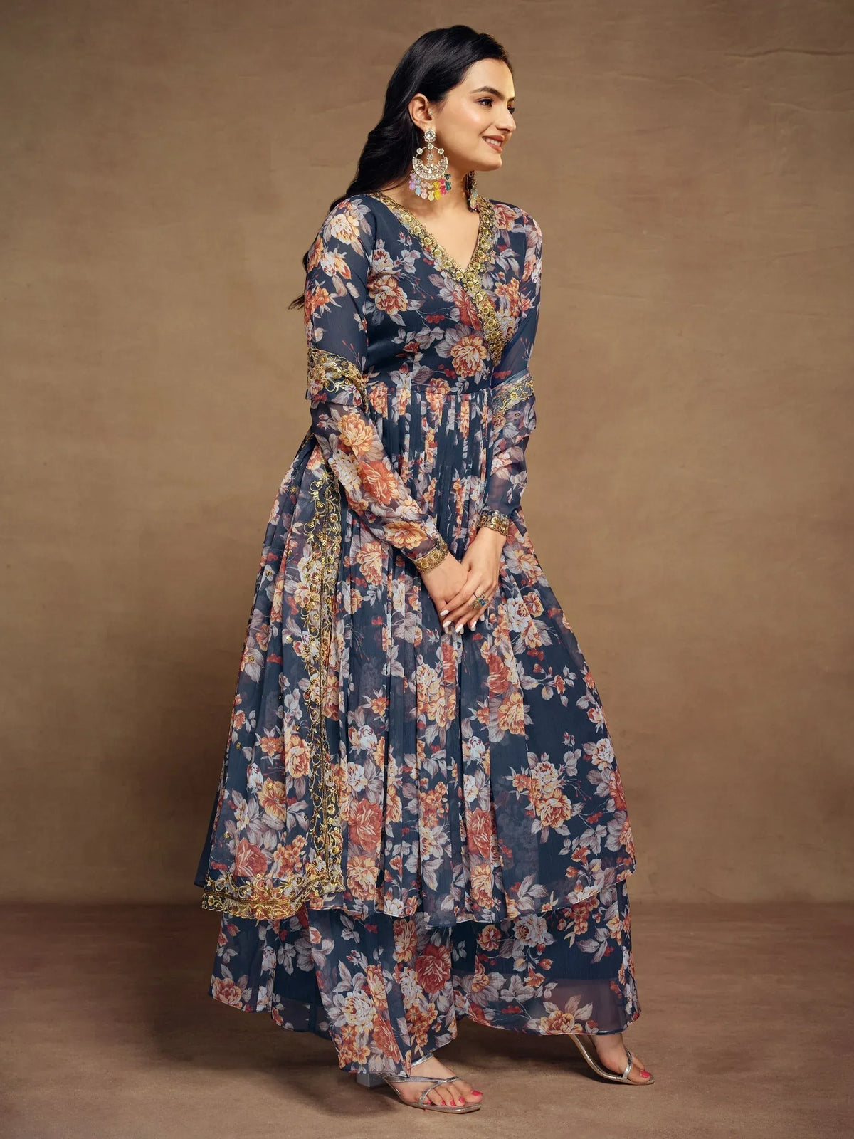 Floral print ethnic gown with gold embroidery, perfect for Indian occasions and festive wear.