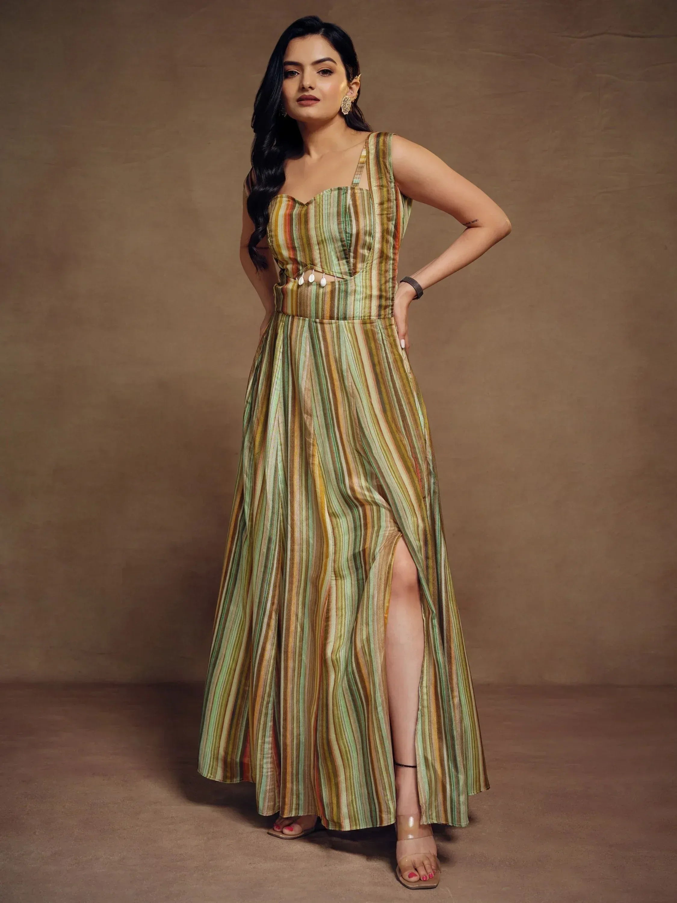 Woman in striped ethnic gown with high slit, perfect for Indian occasions and parties