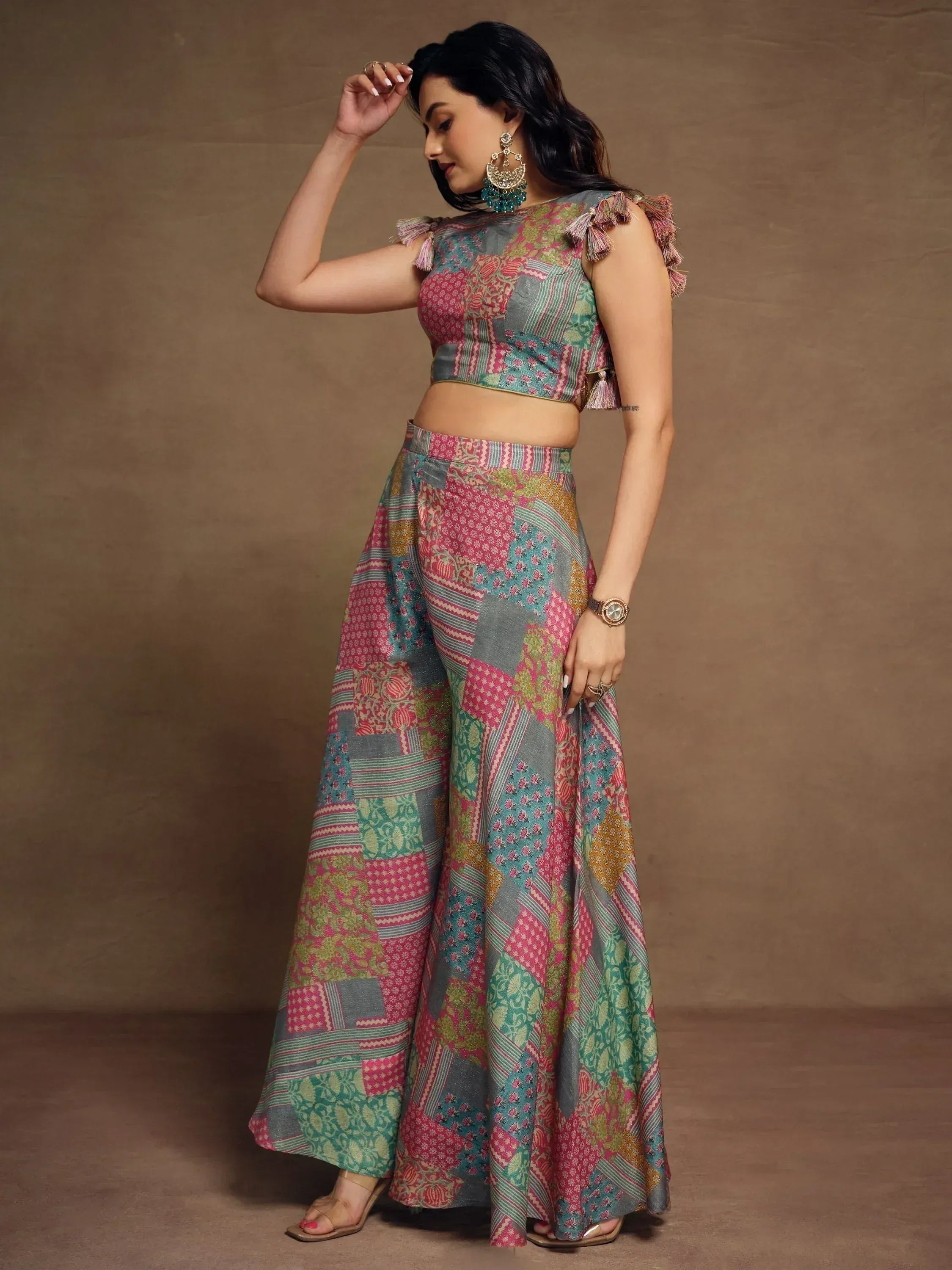 Woman in colorful patchwork Indian ethnic wear with tassel sleeves and palazzo pants