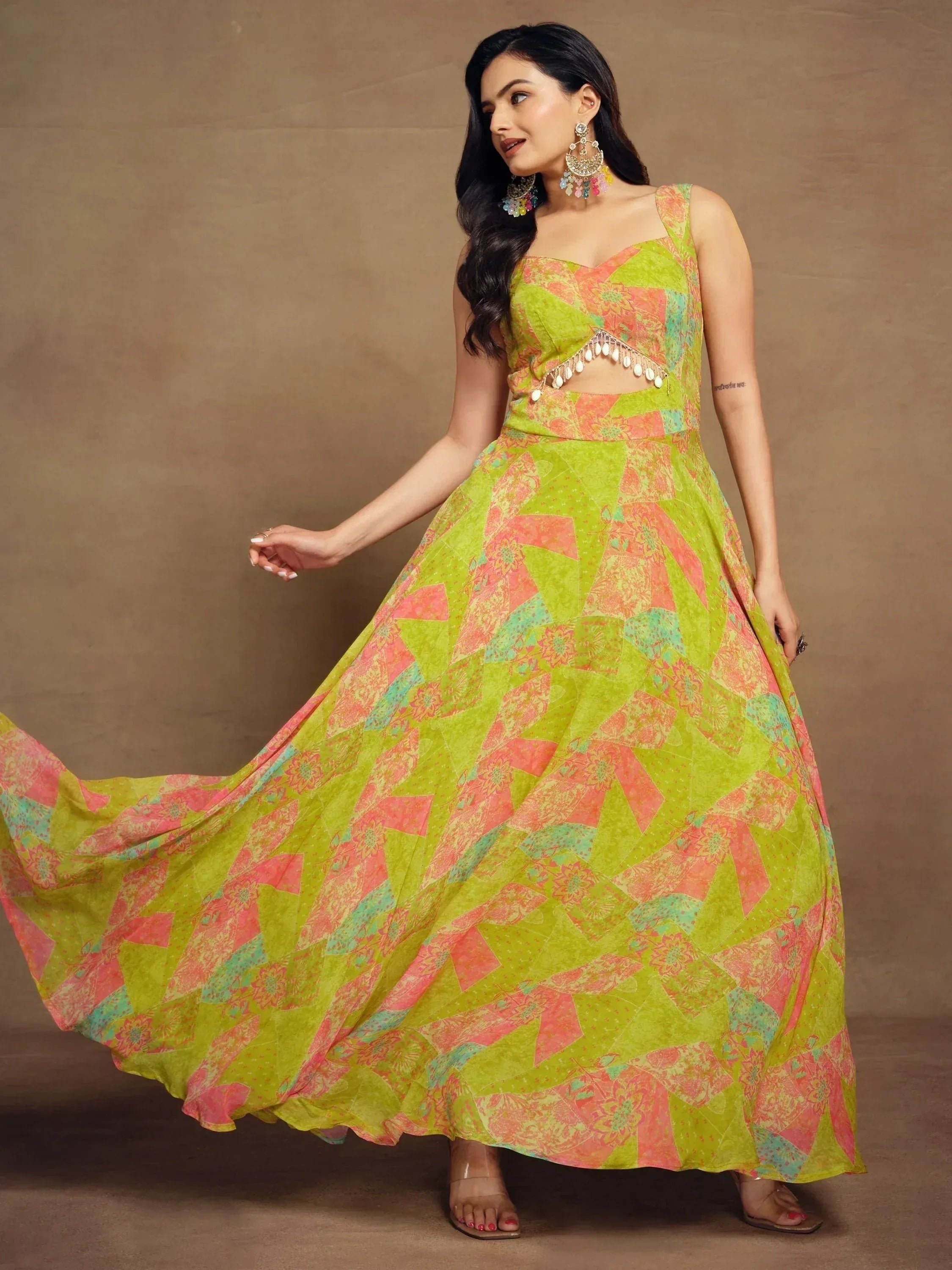 Vibrant green and pink printed ethnic gown with cutout detail, perfect for Indian festive occasions