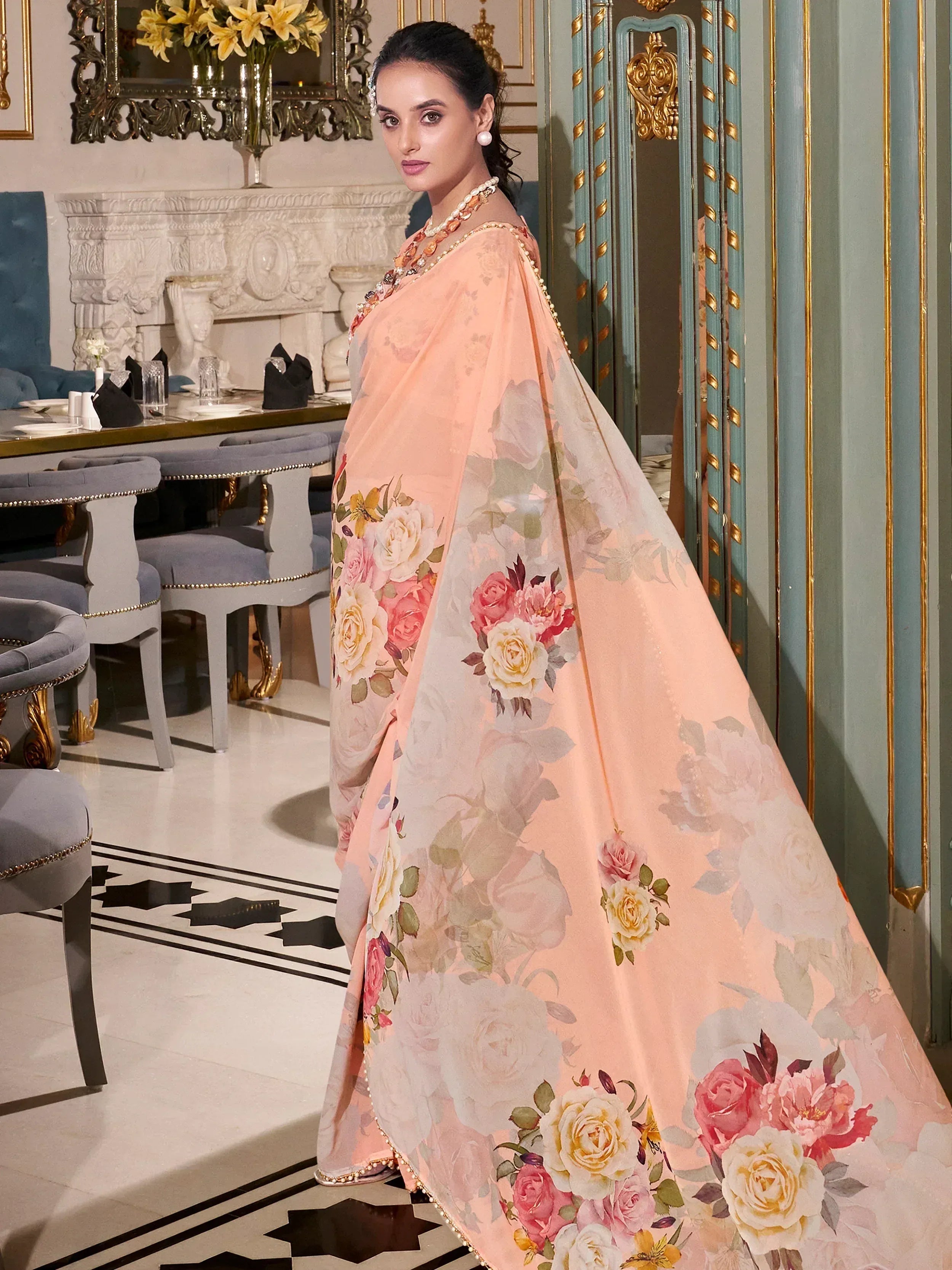 Elegant peach floral saree with rose print, perfect for ethnic occasions and festive wear.