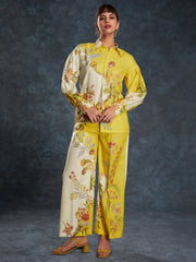 Woman in yellow floral embroidered co-ord set with long sleeves, styled for Ethnic Plus