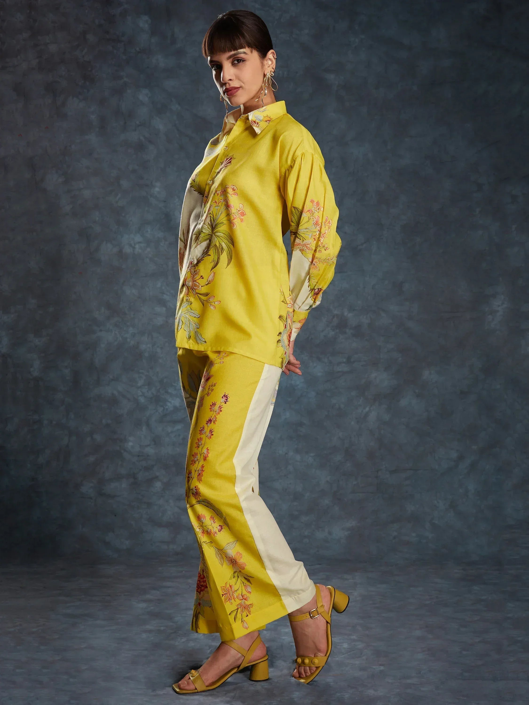 Yellow floral print ethnic shirt and pants set with white side panels, styled with heels for modern Indian wear