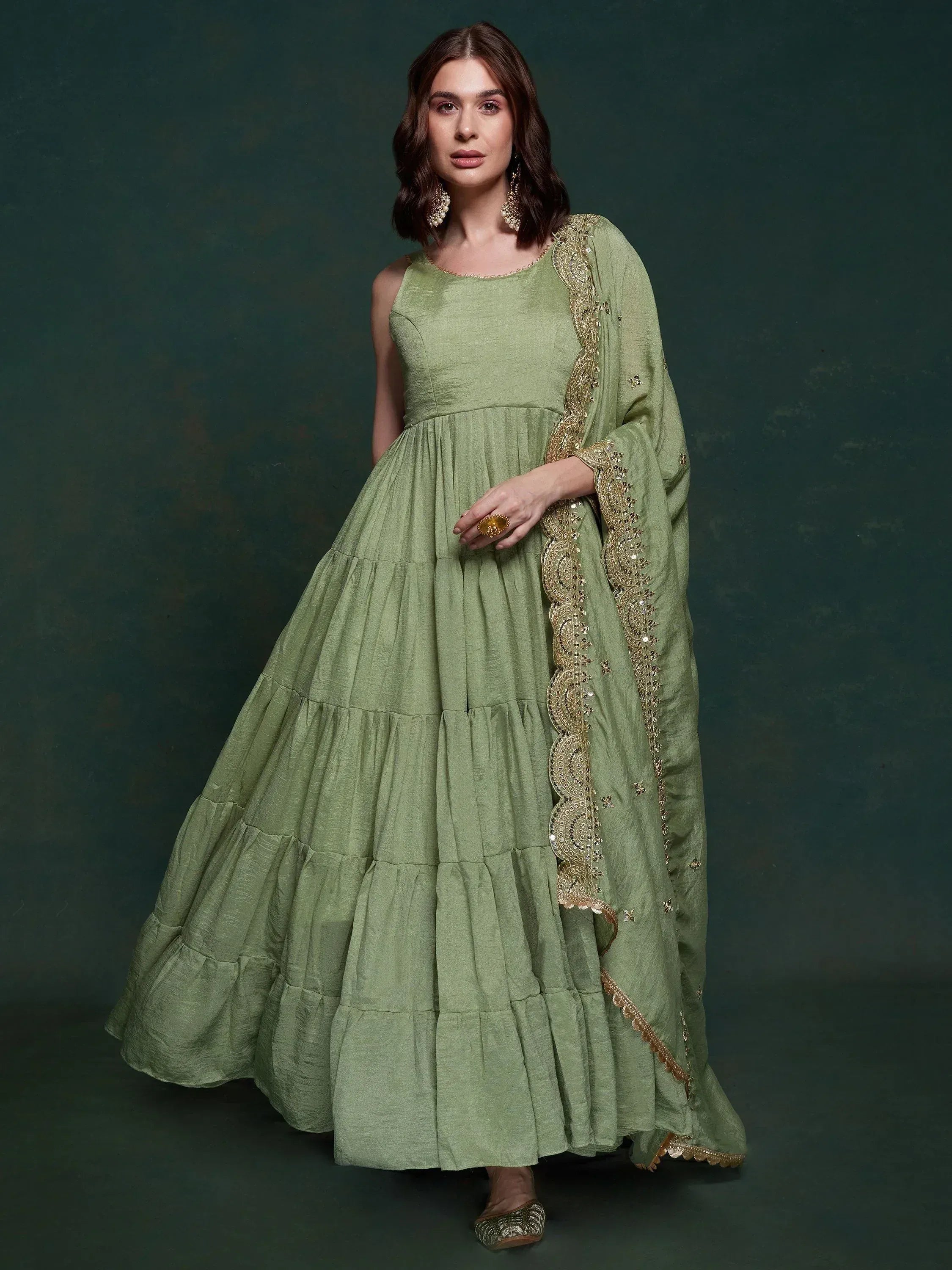 Olive green tiered ethnic gown with gold embroidery and matching dupatta for Indian wear