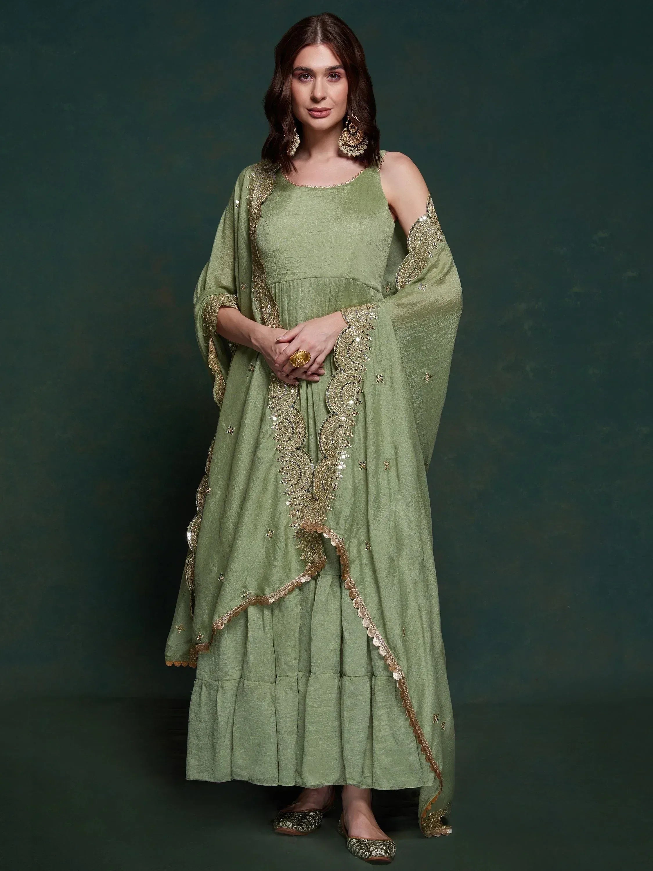 Olive green ethnic gown with gold embroidery, perfect for Indian occasions and festive wear.