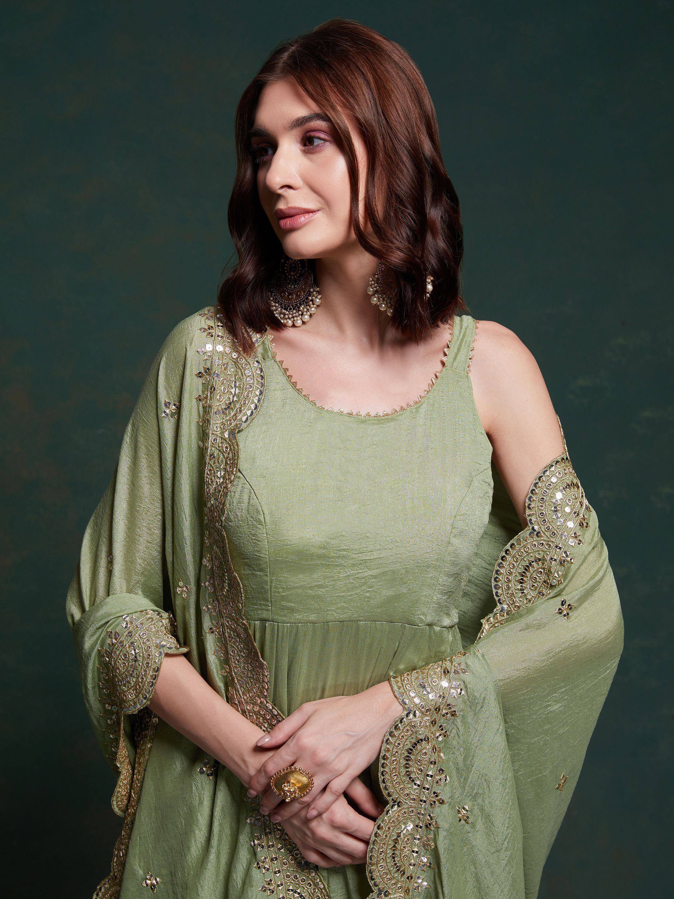 Olive green ethnic gown with gold embroidery and sequins, perfect for Indian festive occasions.
