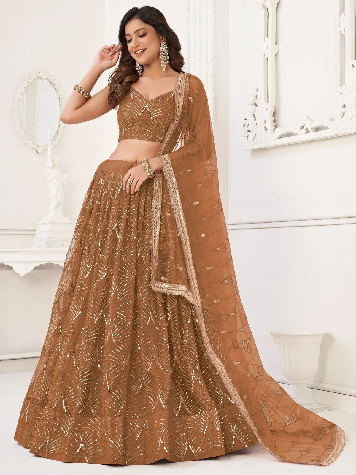 Elegant brown lehenga choli with sequin embroidery and sheer dupatta, perfect for Indian weddings and festive occasions.