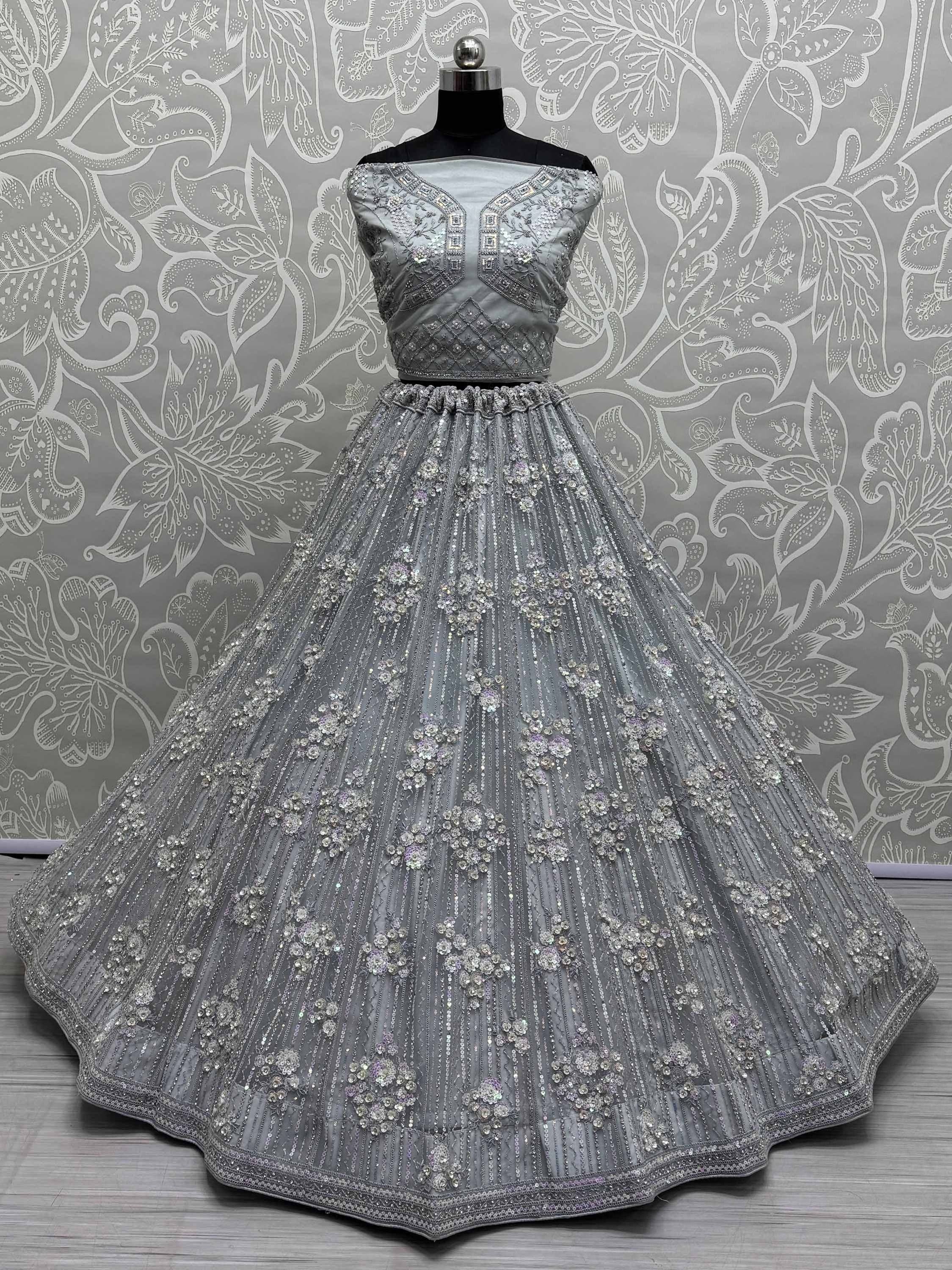 Grey designer lehenga choli with heavy embroidery and sequins, perfect for weddings and parties