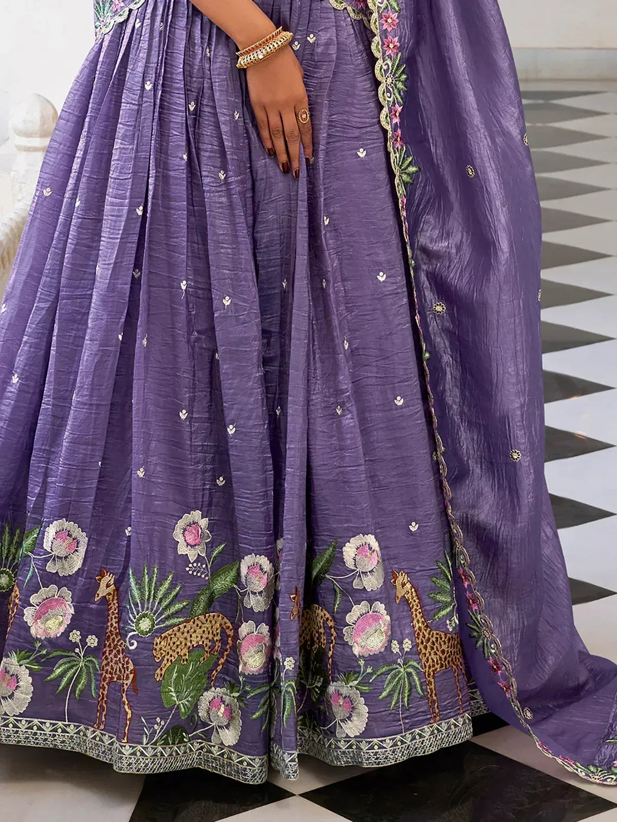 Purple embroidered lehenga with floral and giraffe motifs, perfect for ethnic wear occasions