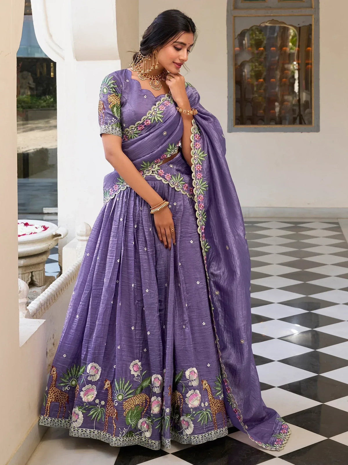 Purple embroidered lehenga choli with floral and giraffe motifs, perfect for Indian ethnic occasions