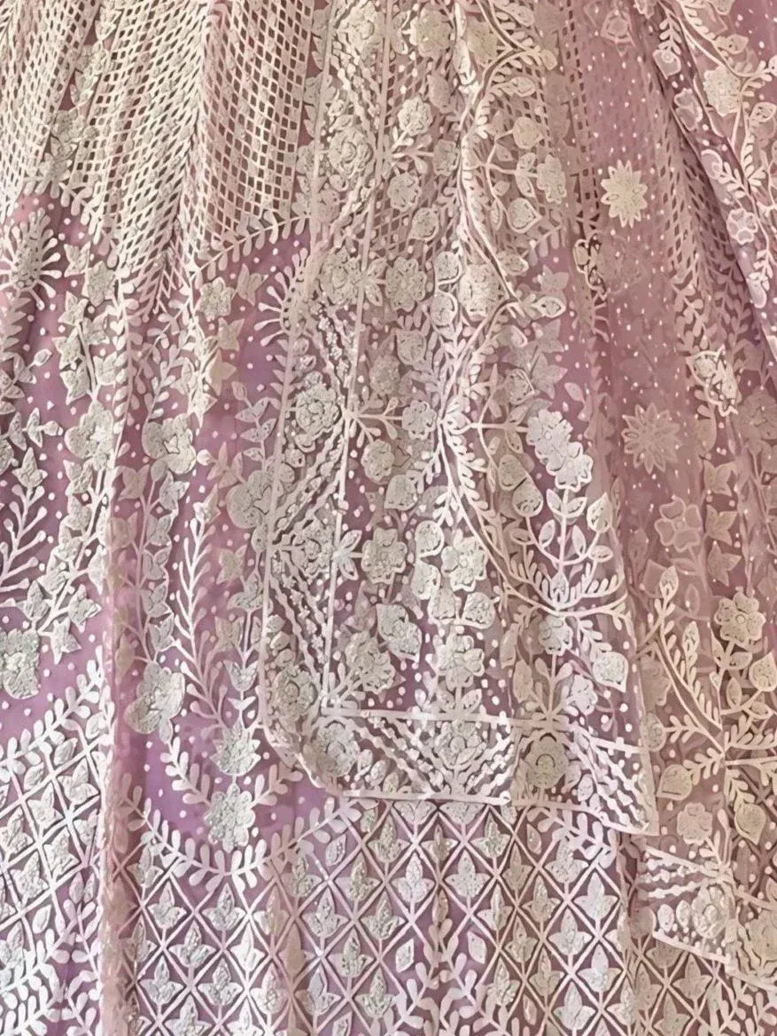 Pink floral embroidered lehenga with intricate gold work and sheer net overlay