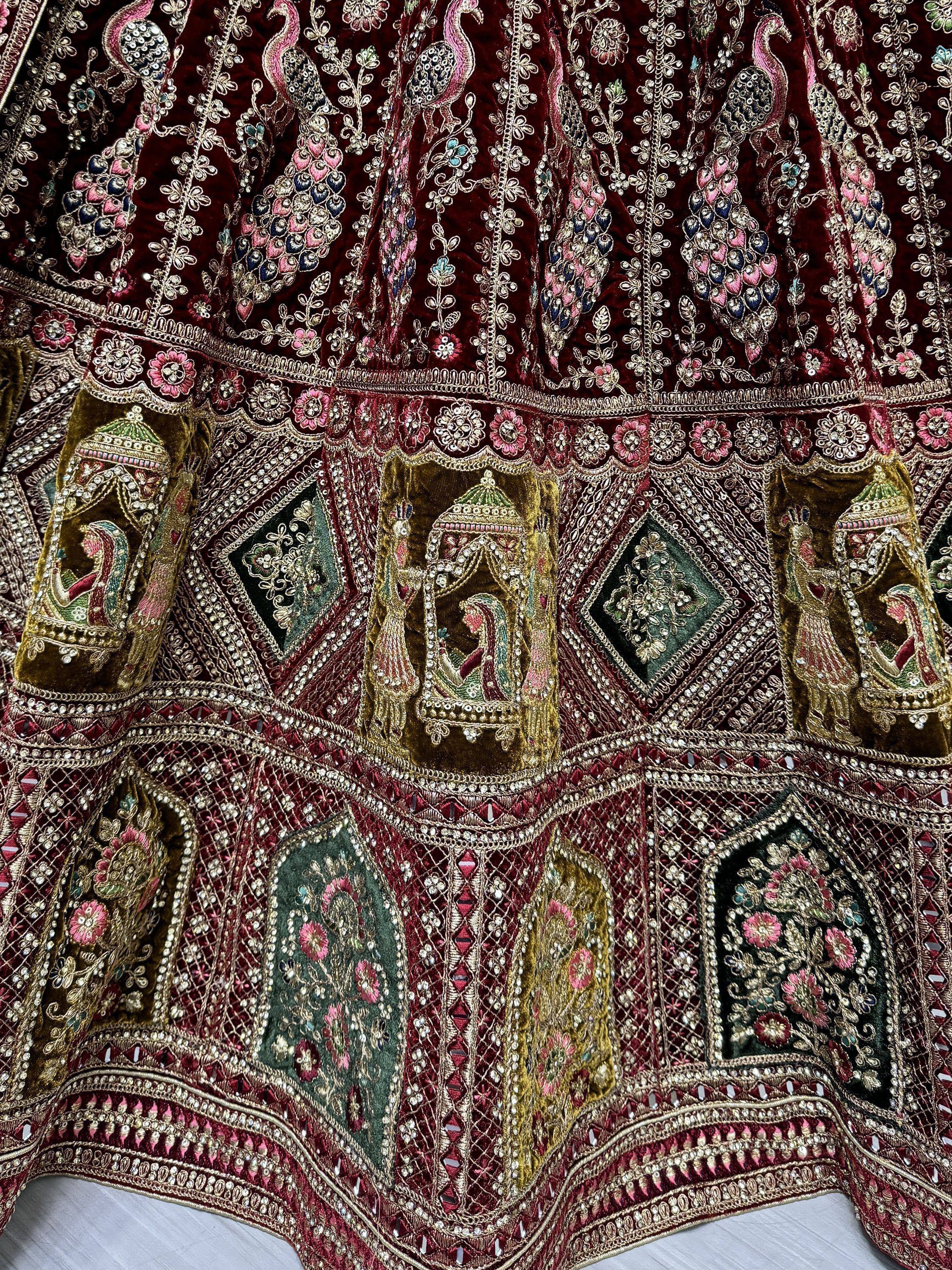 Luxury Indian ethnic lehenga with peacock embroidery, mirror work, and velvet appliqué details