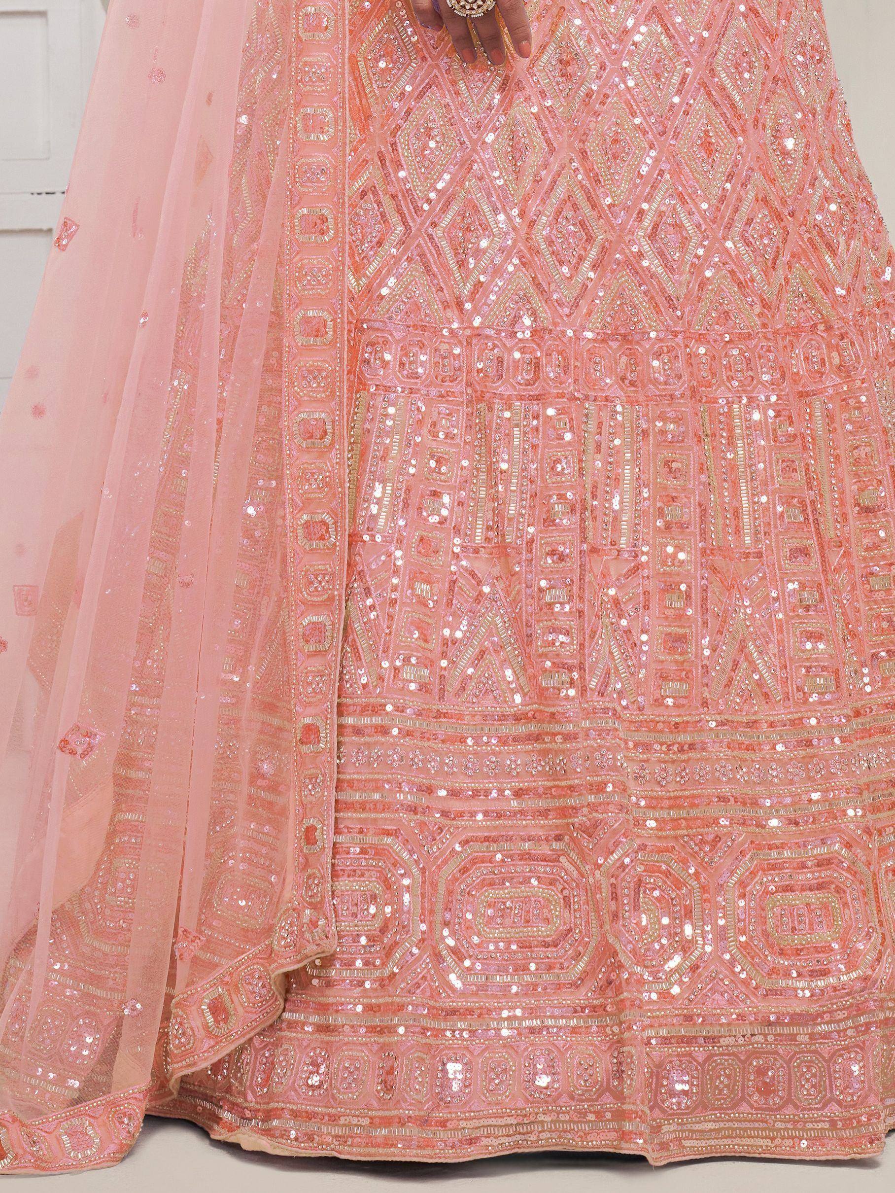 Pink sequin-embellished lehenga with geometric patterns and sheer dupatta, perfect for Indian ethnic wear