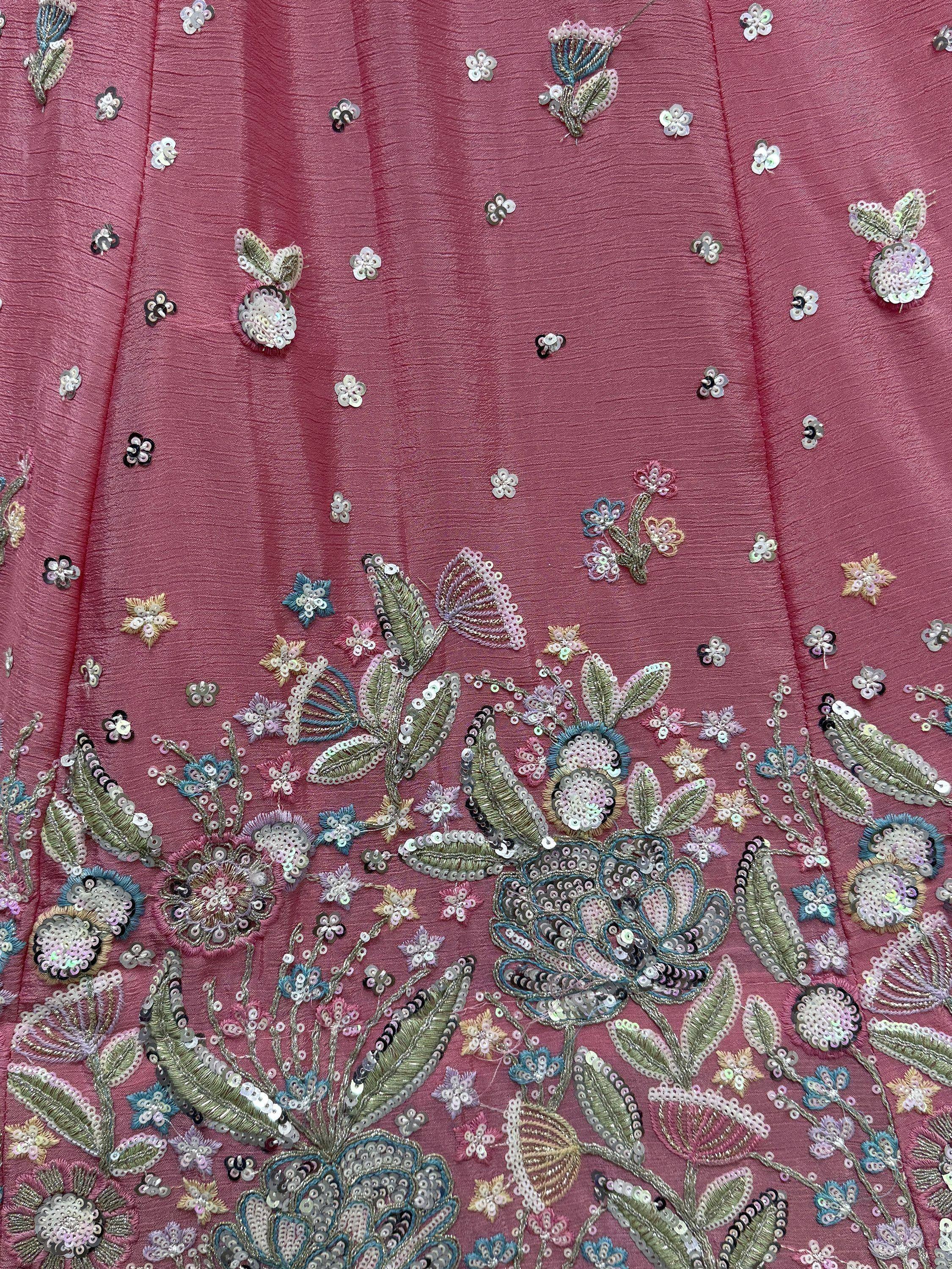Pink ethnic wear with floral sequin embroidery and detailed threadwork for festive occasions