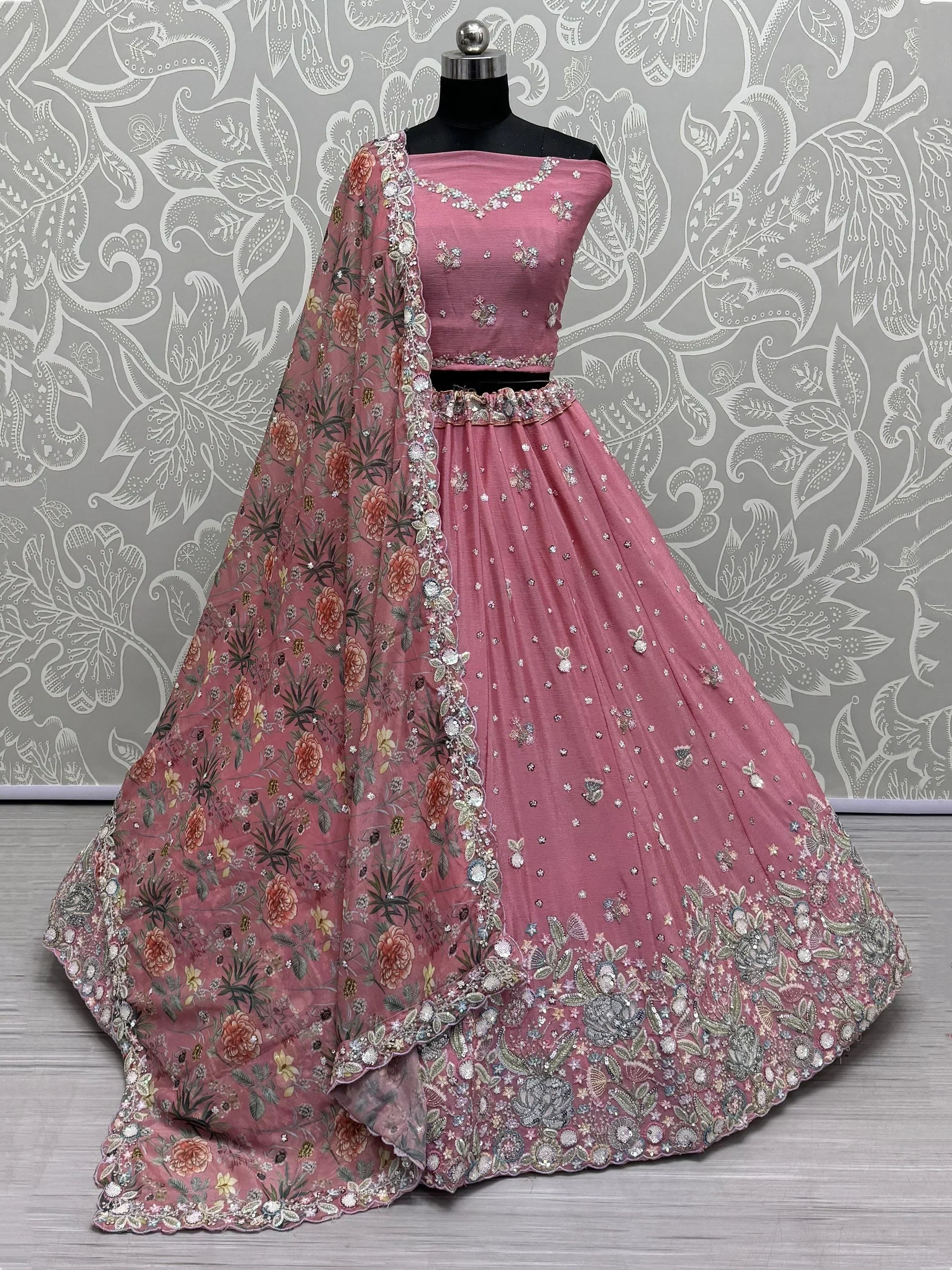 Pink designer lehenga choli with floral dupatta, perfect for Indian weddings and festive occasions