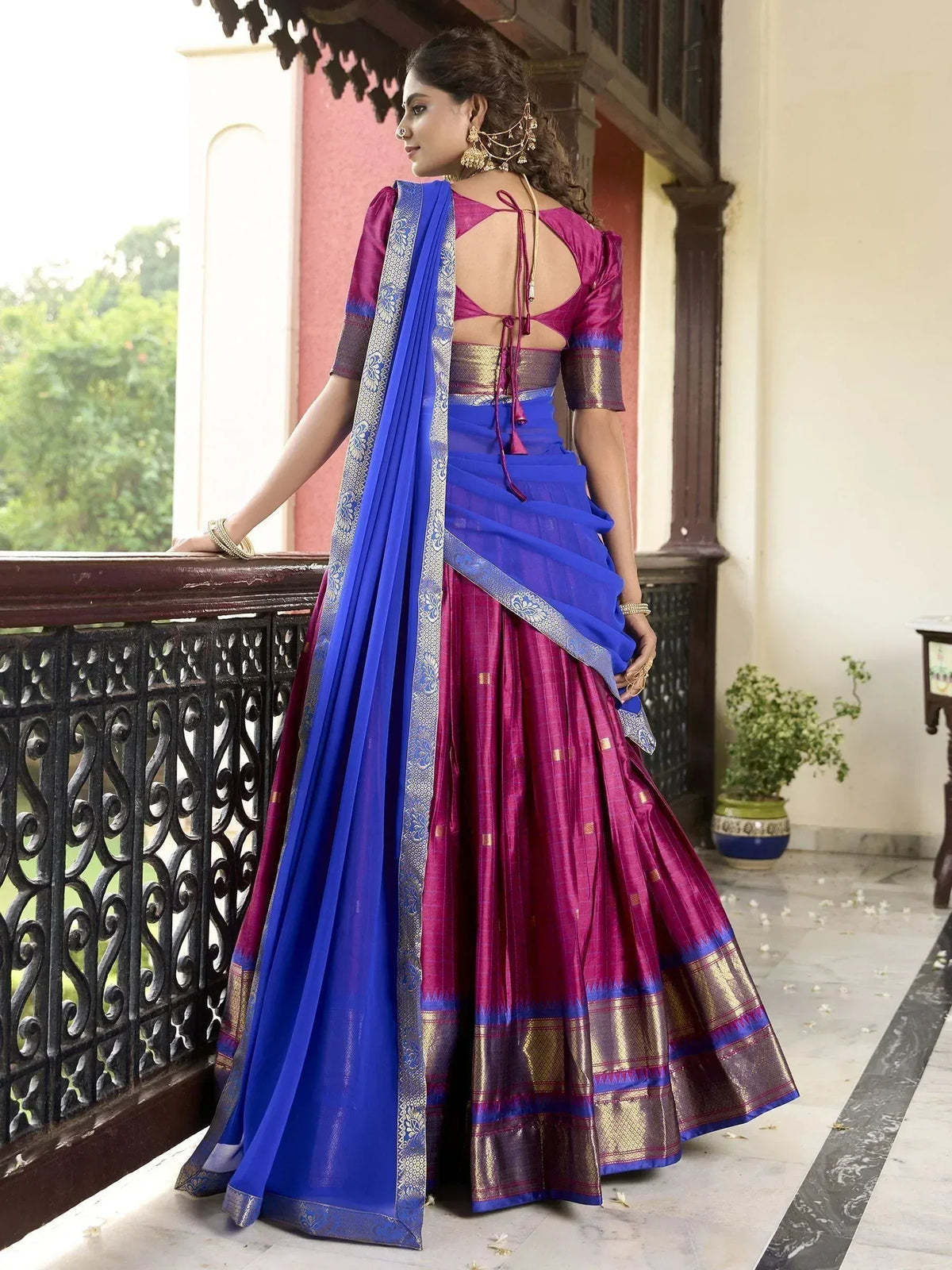Purple and blue designer lehenga choli with backless blouse and embroidered dupatta, perfect for Indian ethnic occasions.