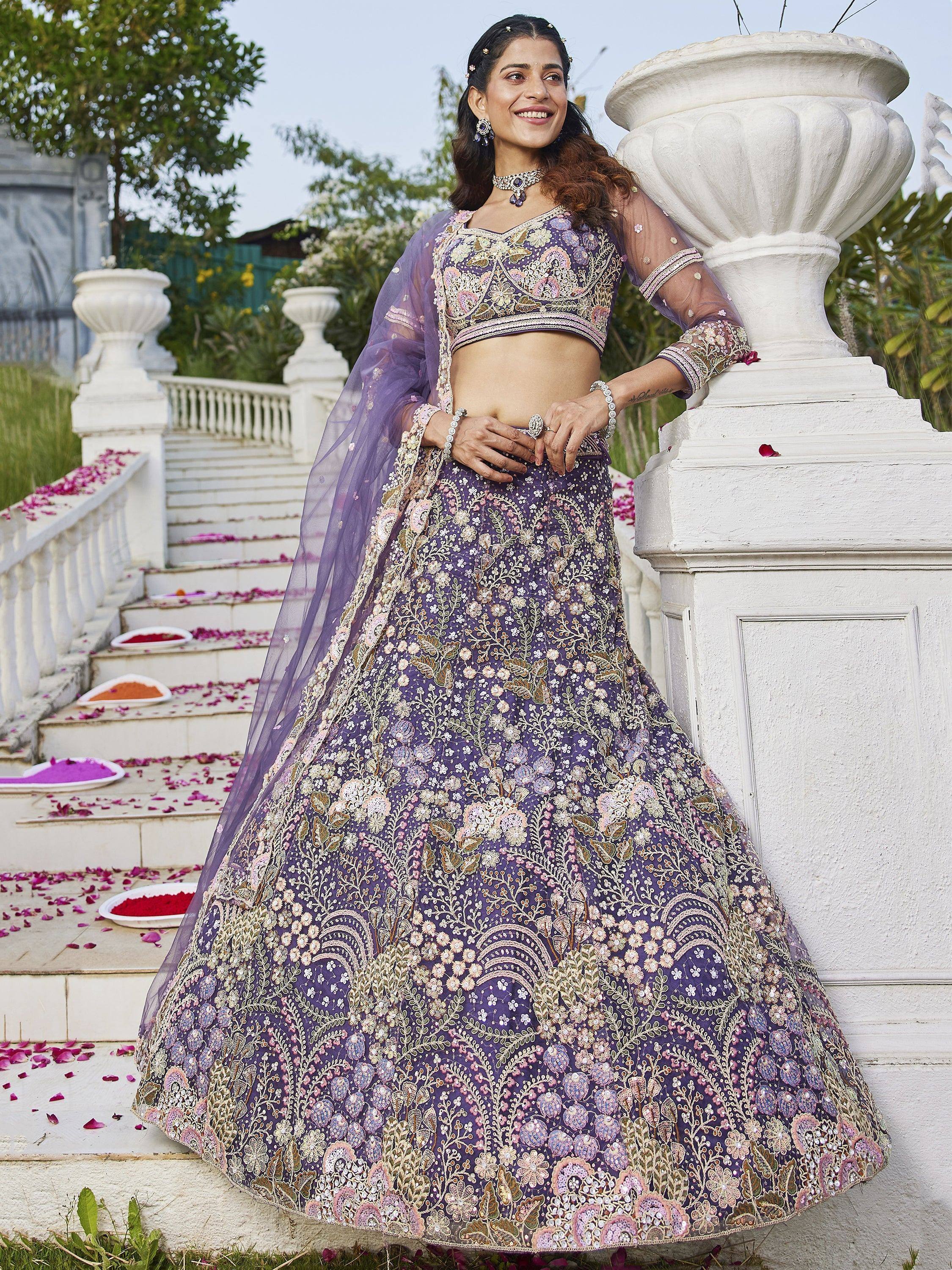 Purple embroidered lehenga choli with floral design, perfect for Indian weddings and festive occasions