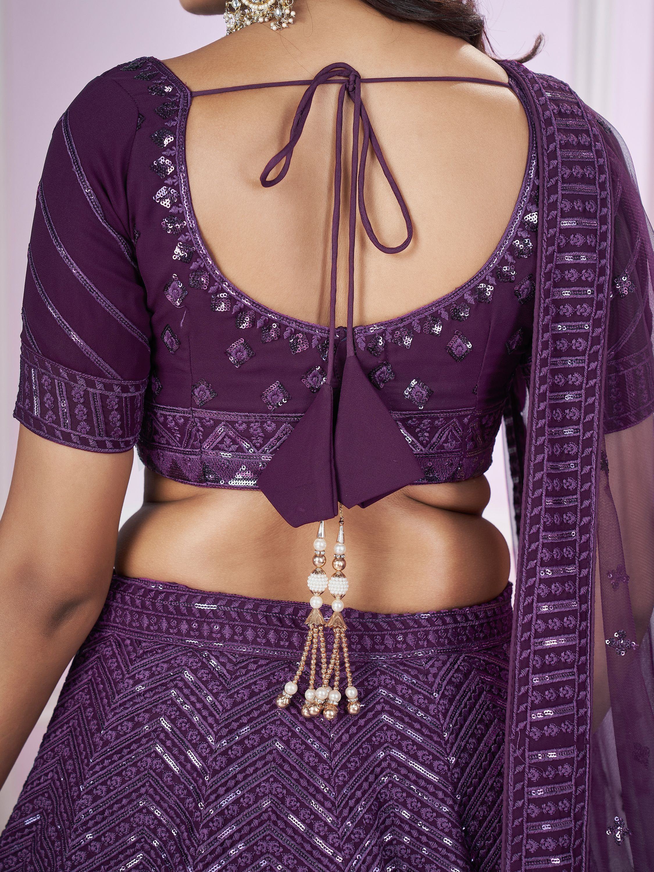 Purple designer lehenga choli with back tie, sequin embroidery, and pearl tassels for ethnic wear